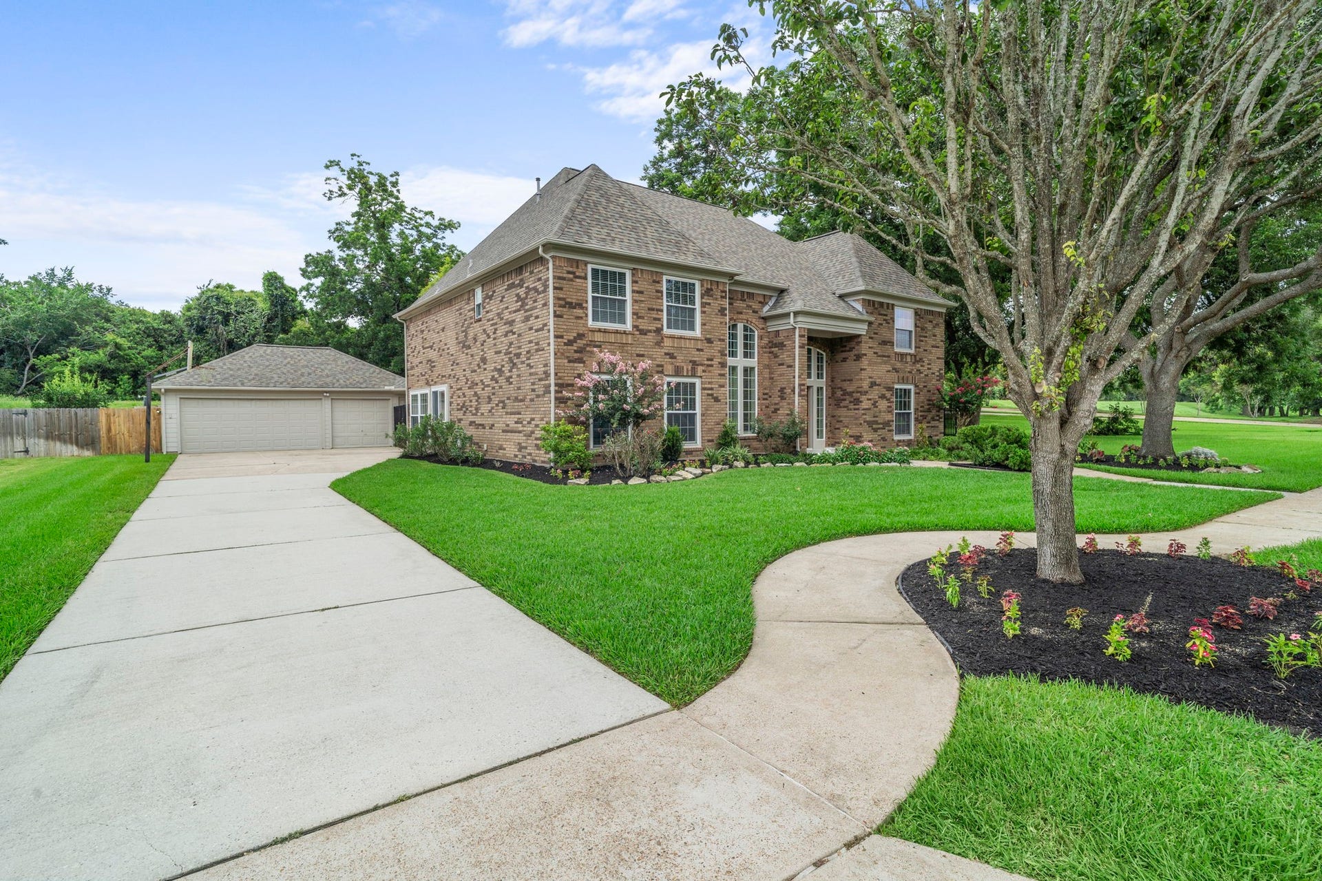 A long driveway leading to the detached 3-car garage for ample parking.