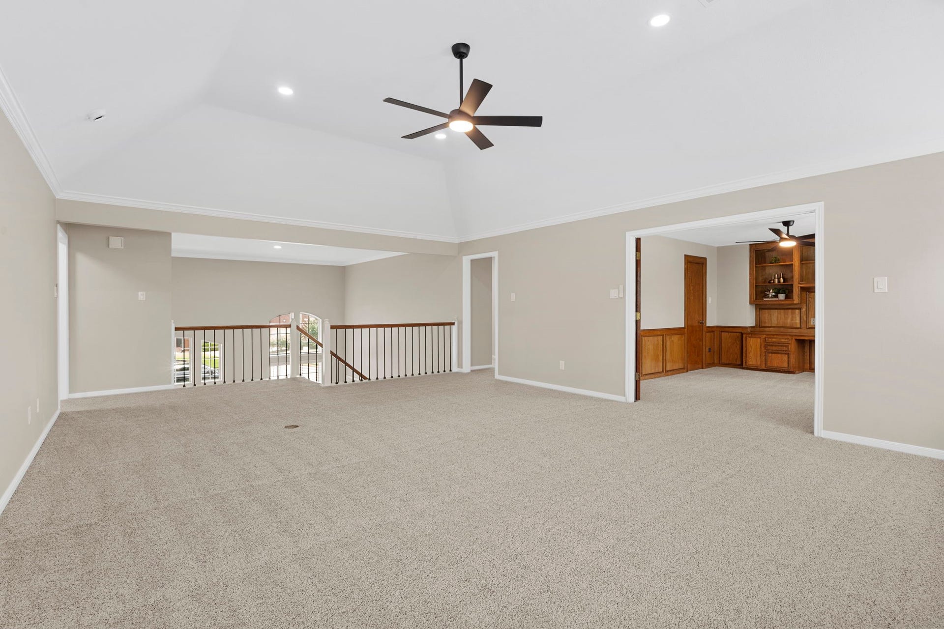 The expansive upstairs game room offers exceptional flexibility for a secondary living area, play space or media retreat, with convenient access to the private study.