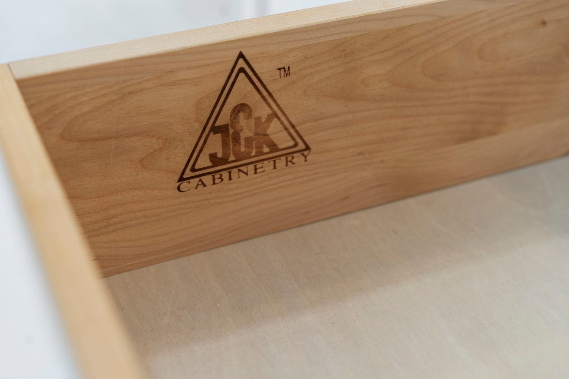 Quality craftsmanship is found throughout, including JCK Cabinetry with solid wood drawer constructiona detail that speaks to the kitchens thoughtful design.