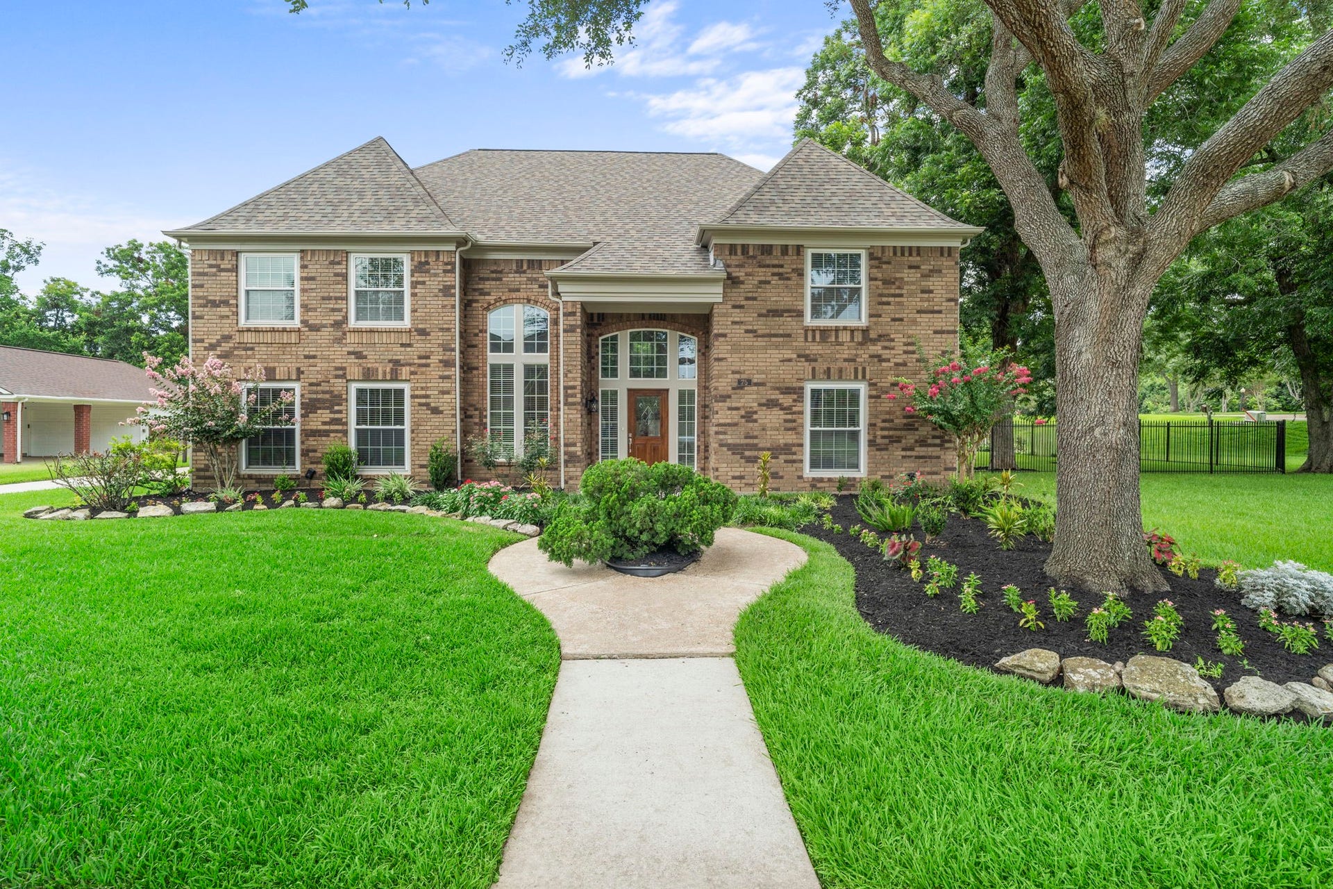 A stately brick exterior is complemented by a grand two-story entry, mature trees & beautifully refreshed landscaping, creating an impressive welcome from the moment you arrive.