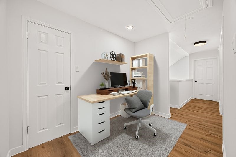 Chic and functional home office space featuring a sleek desk, comfortable chair, and ample storage, all set against a backdrop of elegant wood flooring and bright walls.