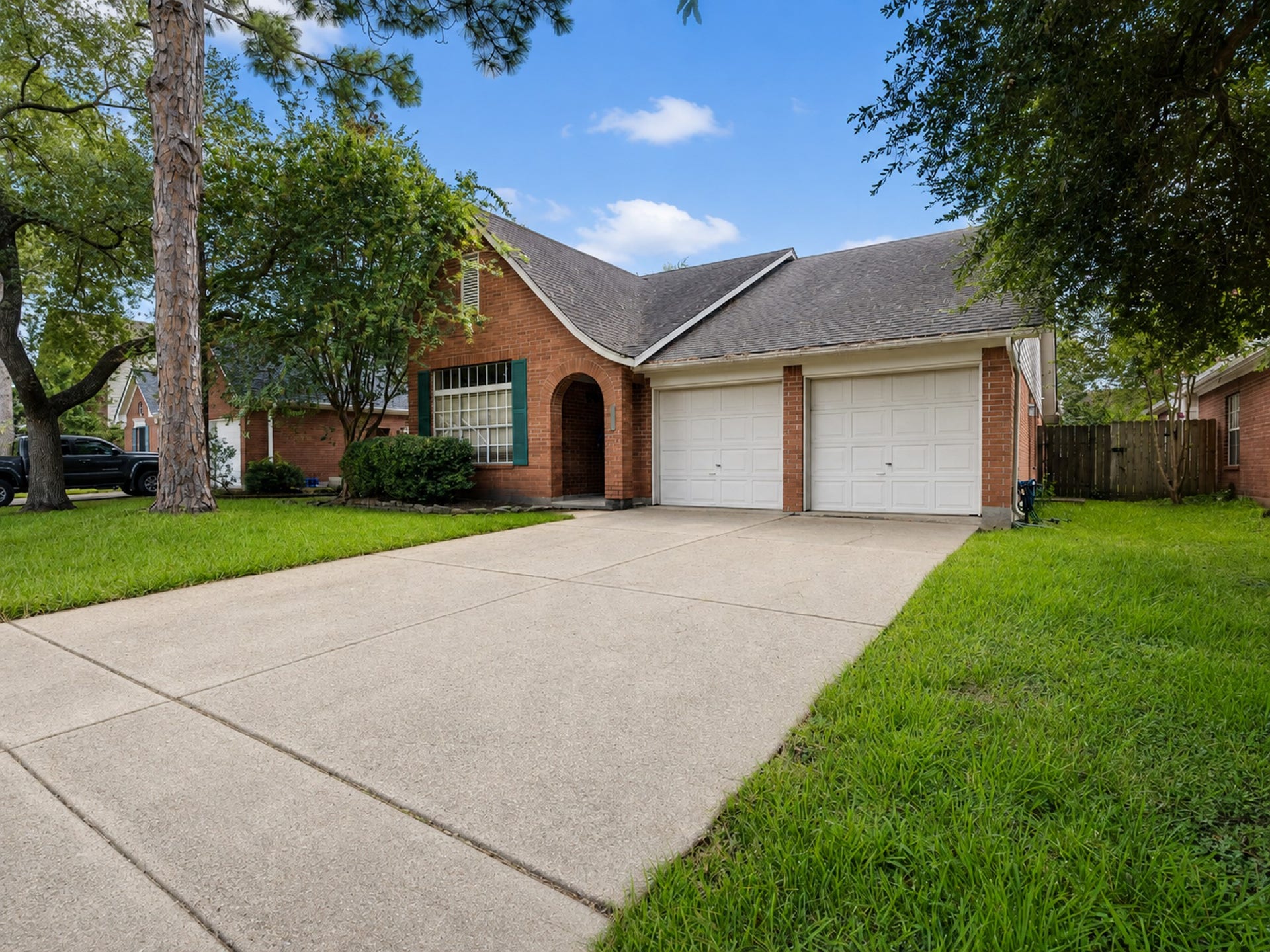 This four sided brick one story with a classic Tudor elevation is sure to check all of the boxes