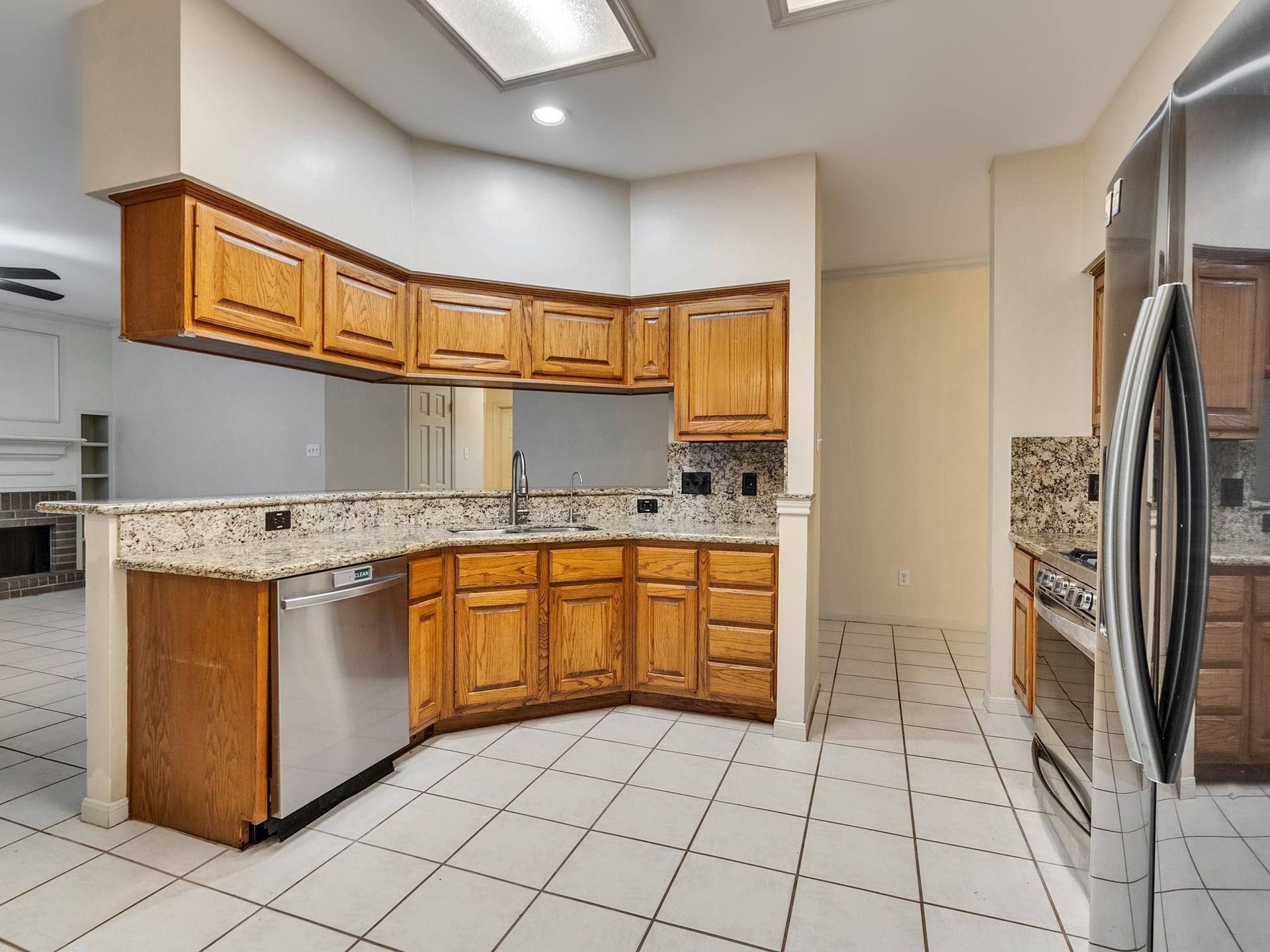 The kitchen features ample storage space and a surplus of outlets for convenience