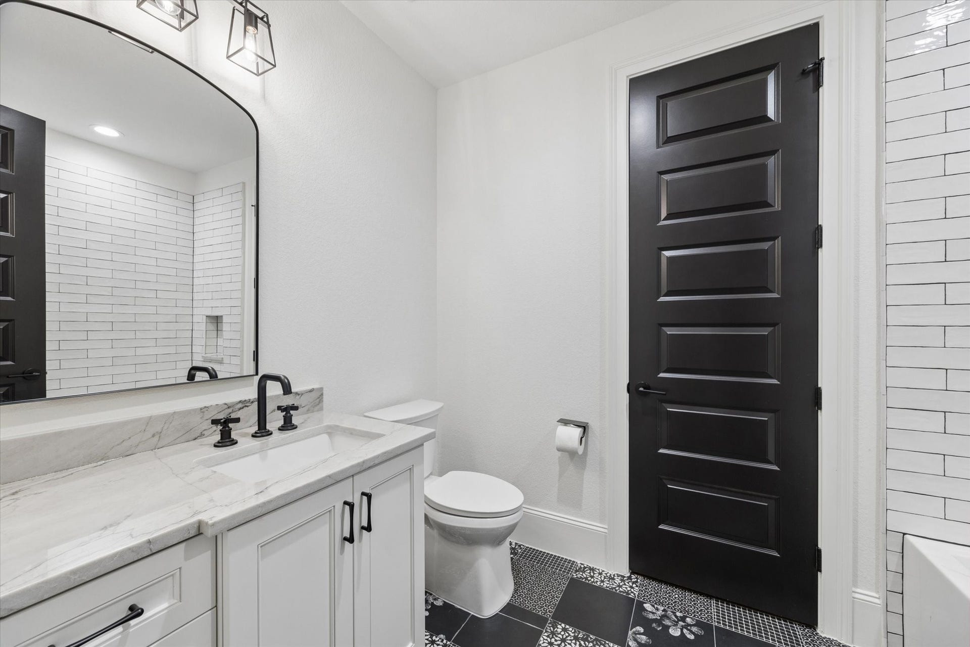 Timeless finishes, quality cabinetry, and elegant details elevate this beautifully appointed bath, reflecting the same exceptional craftsmanship found throughout the residence.