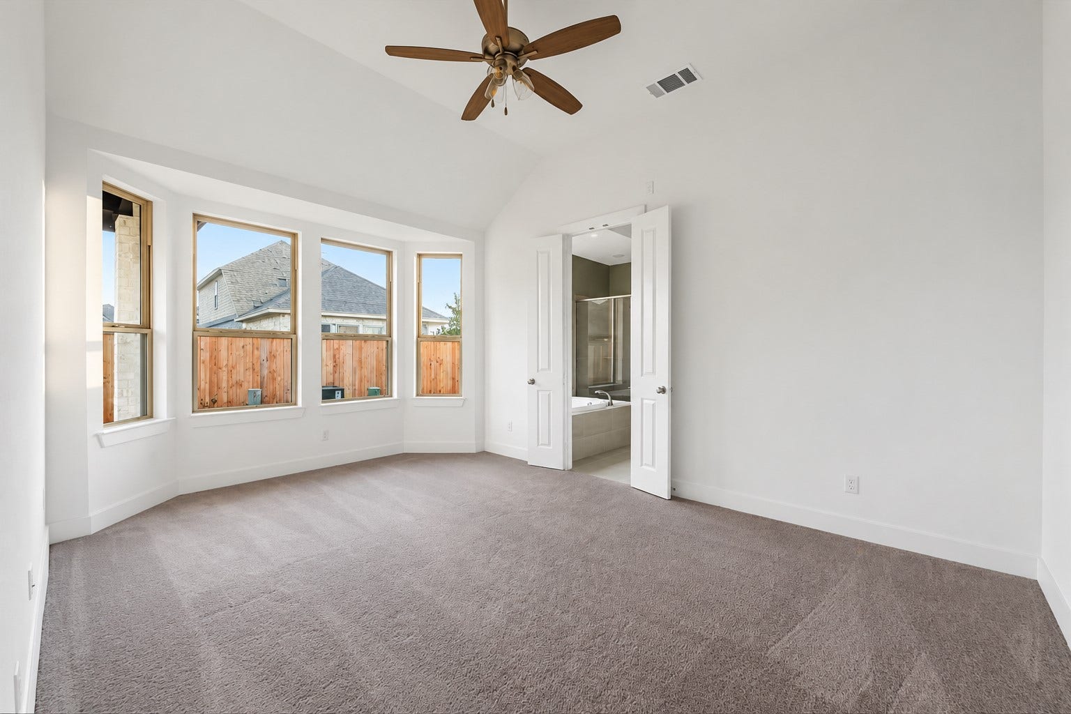20943 Blooming Shrubs Court, Cypress, TX 77433 Spacious primary bedroom is tucked away in the back of the home.
