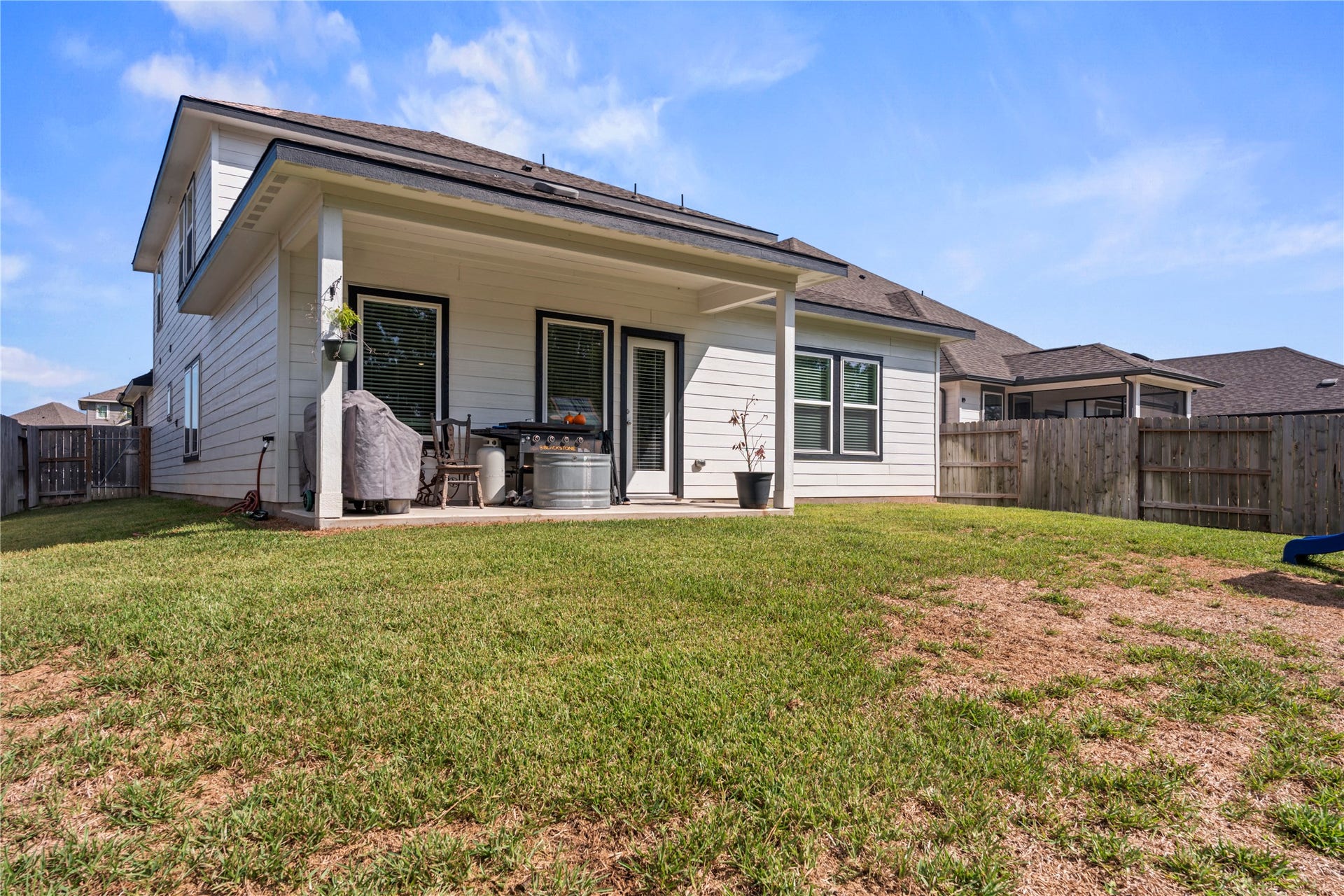 38527 Winding Meadows Drive, Magnolia, TX 77354 Large yard, covered patio, and no back neighbors.