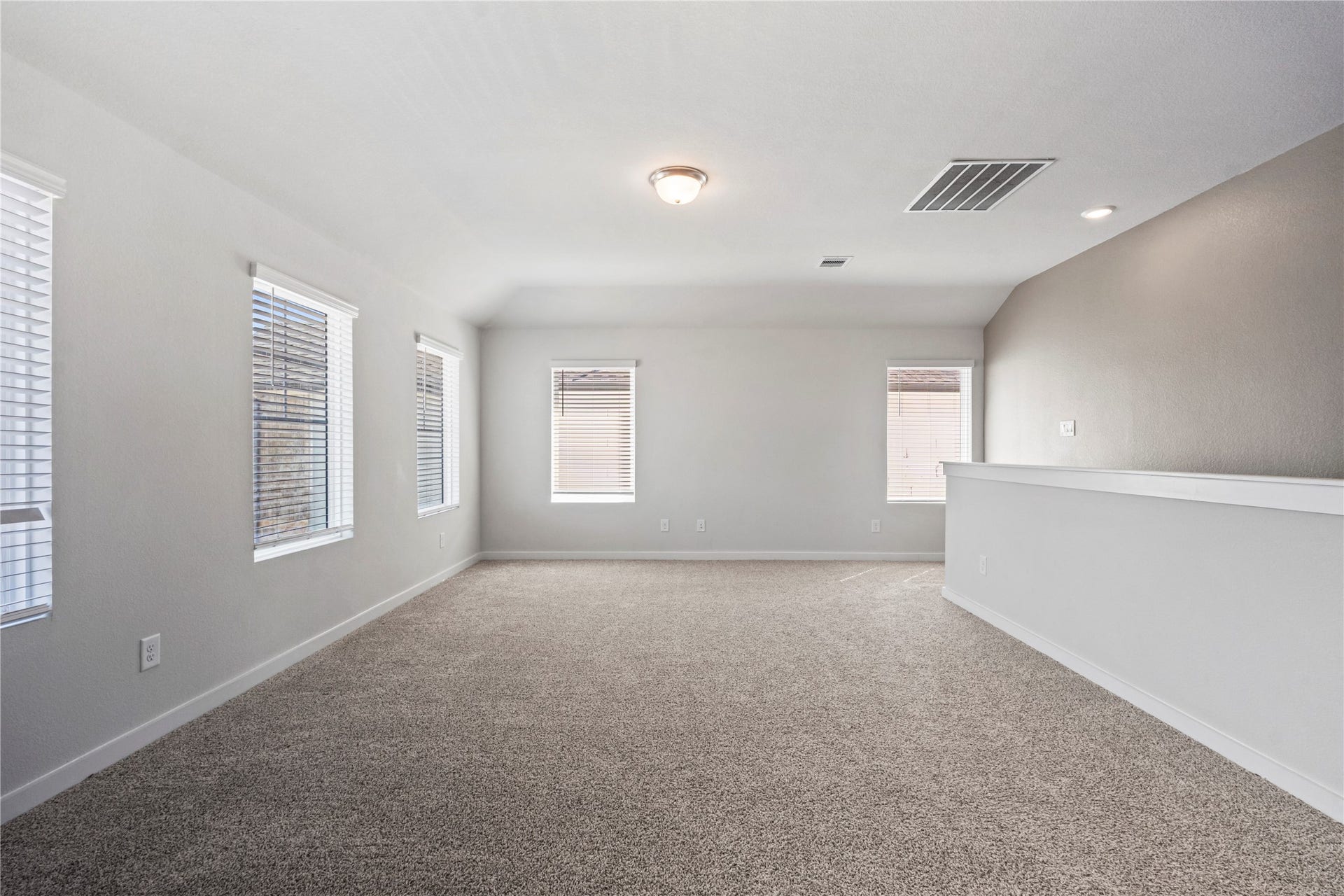 38527 Winding Meadows Drive, Magnolia, TX 77354 The game room area and a view of the staircase to the right.