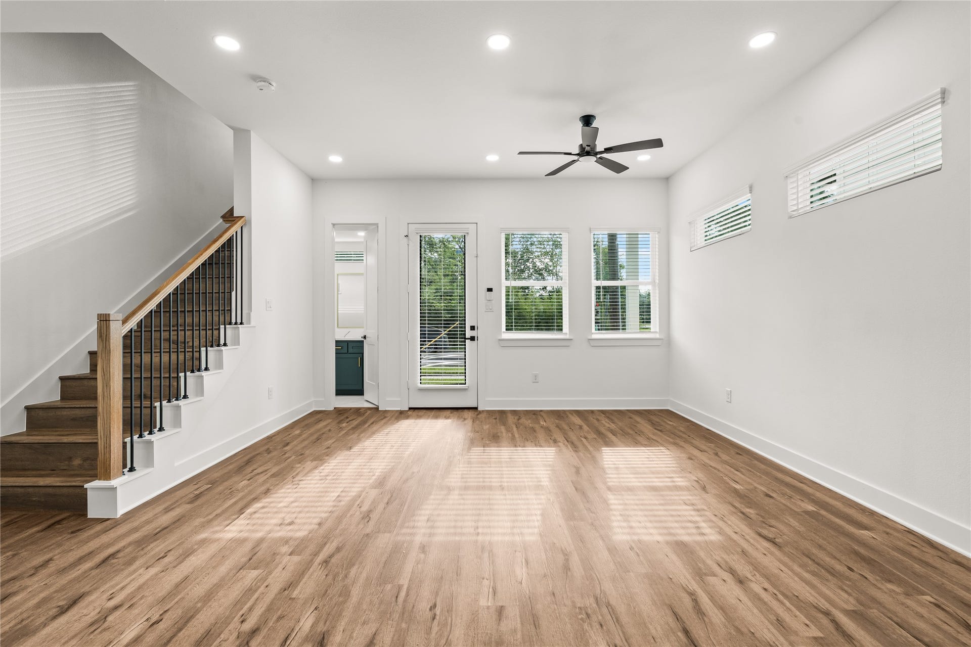 4702 & 1912 Schweikhardt Street, Houston, TX 77020 Architectural elegance on display. The modern staircase with sleek iron spindles serves as a beautiful backdrop to your main living zone.