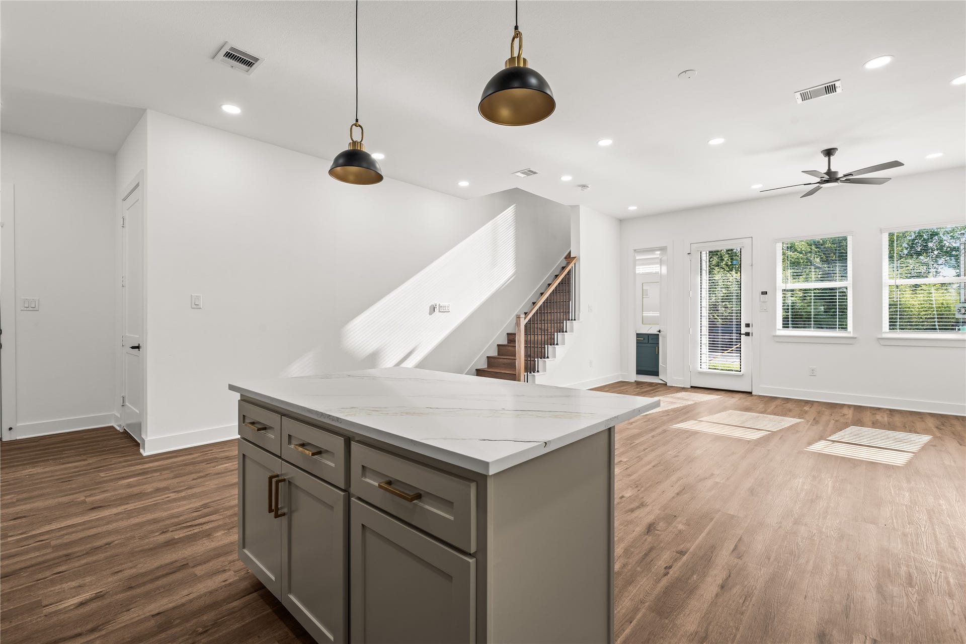 4702 & 1912 Schweikhardt Street, Houston, TX 77020 Natural light dancing across the room. The transition from the kitchen island to the open living space is completely effortless.
