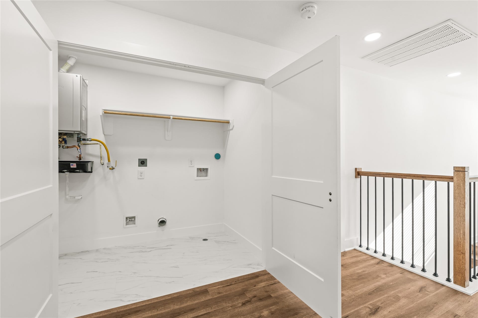 4702 & 1912 Schweikhardt Street, Houston, TX 77020 Efficiency at its finest. No more carrying heavy baskets up and down the stairsthis upper-level laundry zone puts chore day right where the bedrooms are.