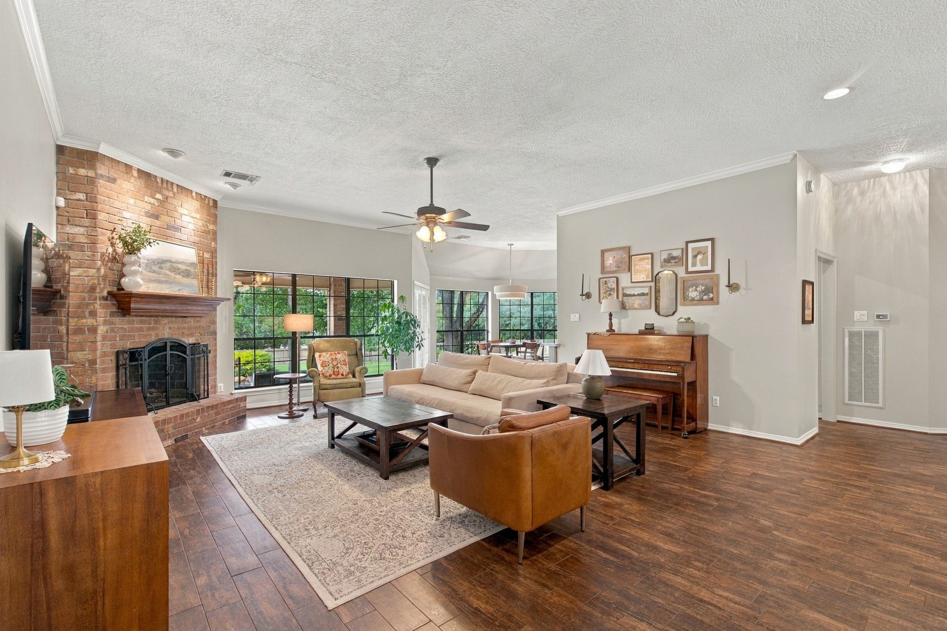23327 Cannon Creek Trail, Tomball, TX 77377 Spacious family room anchored by a striking wood-burning fireplace.
