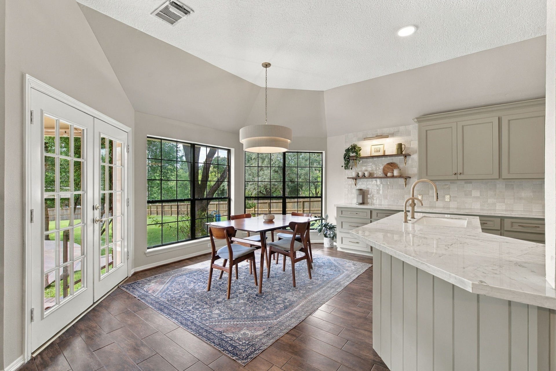 23327 Cannon Creek Trail, Tomball, TX 77377 Sunny breakfast area features large windows with peaceful backyard views.