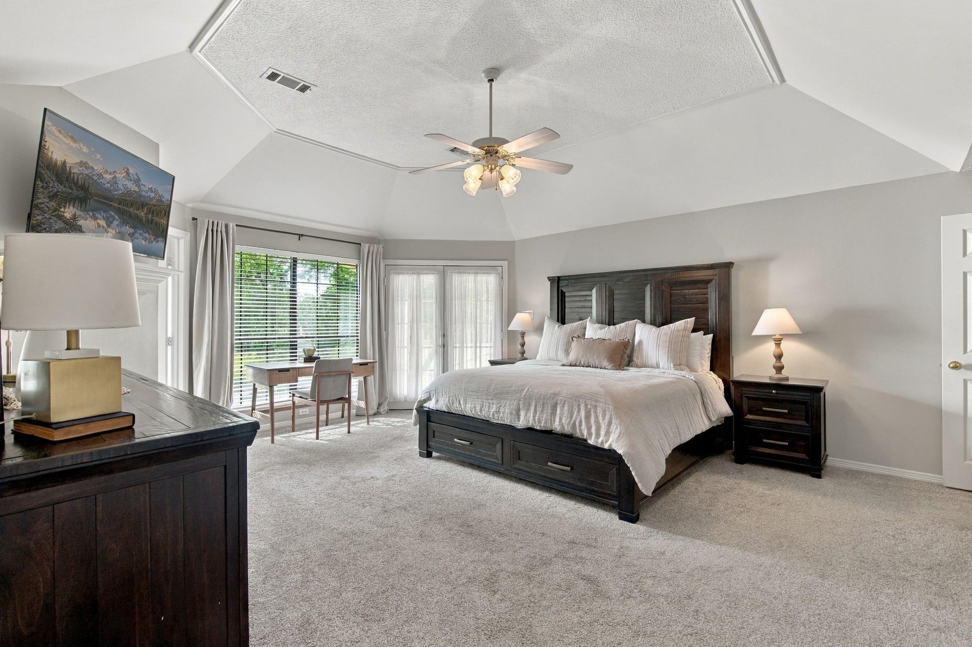 23327 Cannon Creek Trail, Tomball, TX 77377 Spacious primary bedroom with large windows and views of the backyard.
