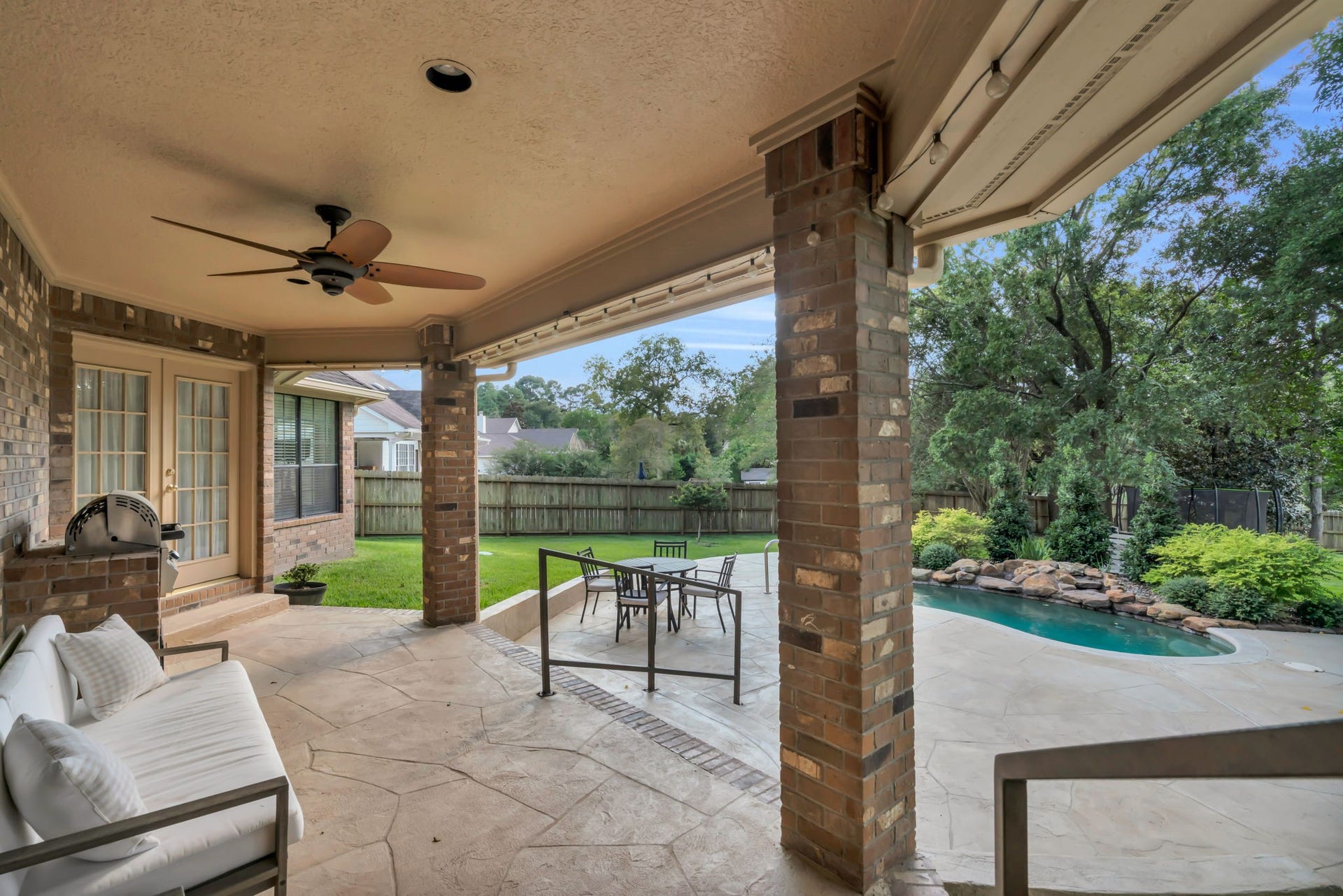 23327 Cannon Creek Trail, Tomball, TX 77377 Covered back patio creates a comfortable outdoor living and entertaining space.