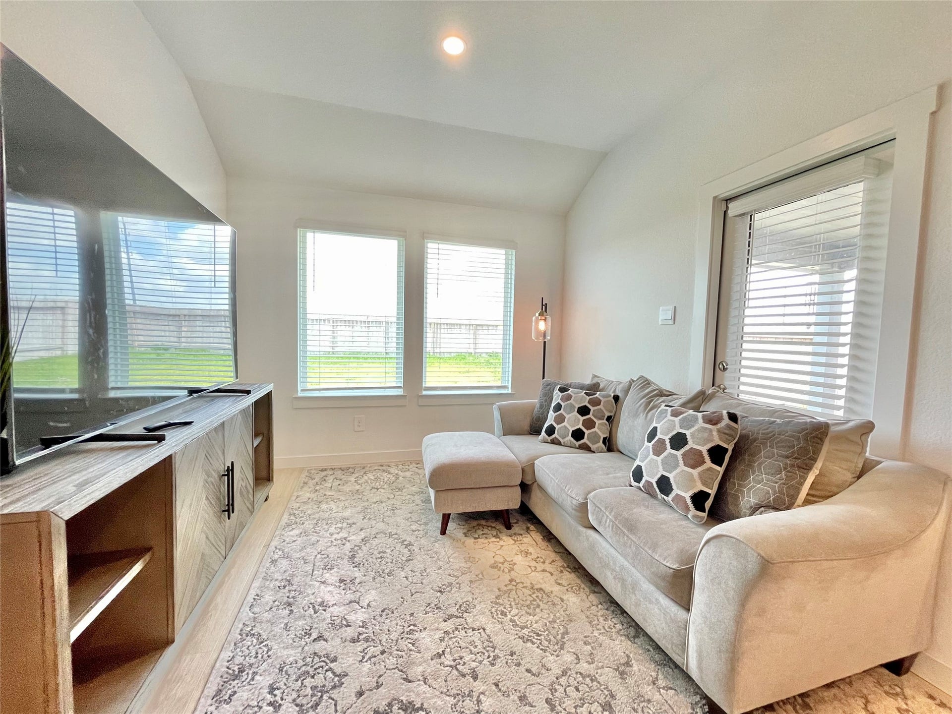 31722 Farlam Farms Trail, Fulshear, TX 77441 Wind down in this dedicated media den, tailored for cozy movie nights and ultimate comfort.