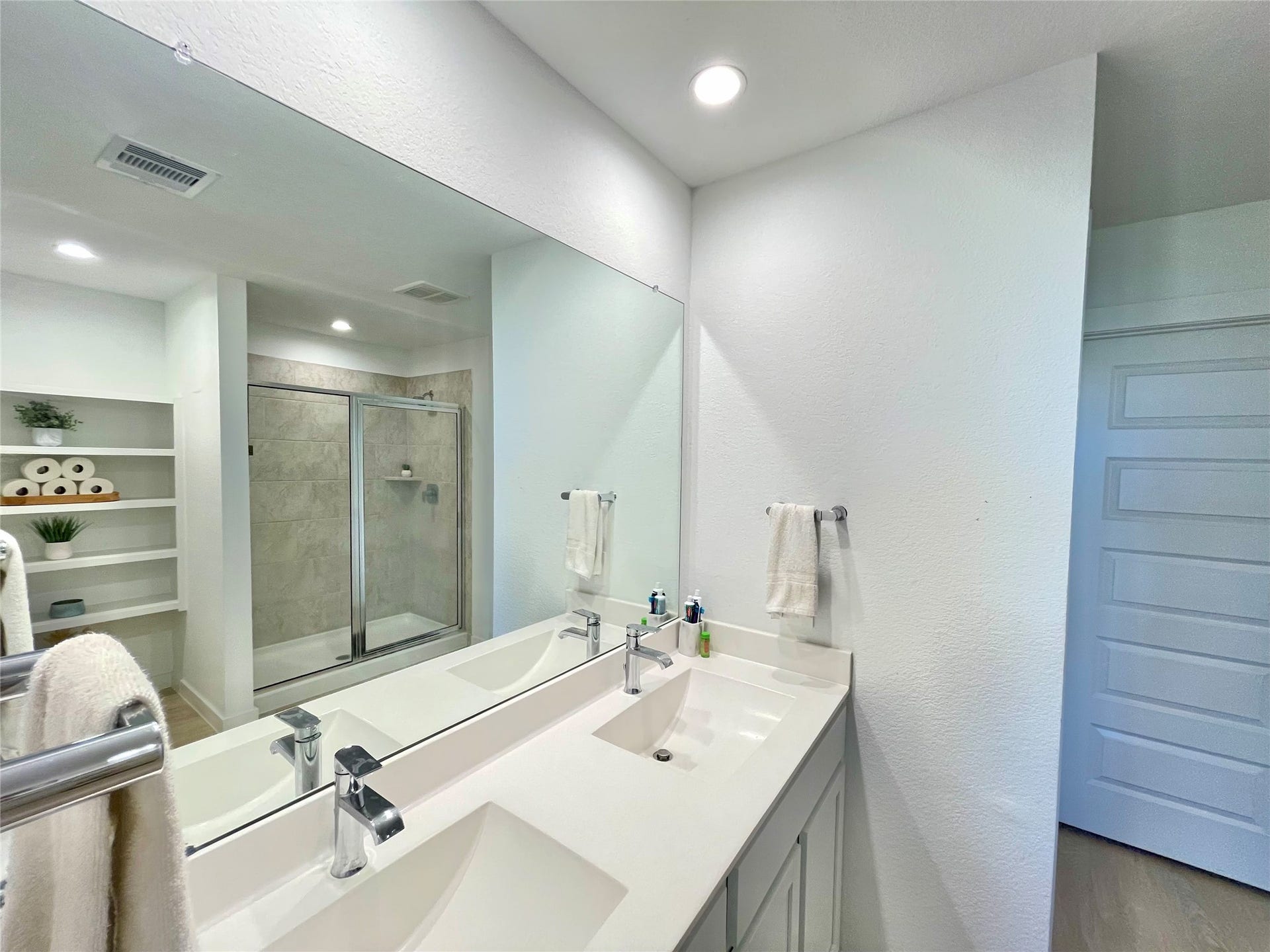 31722 Farlam Farms Trail, Fulshear, TX 77441 Spa-like primary bathroom equipped with an extra-wide double vanity, crisp modern finishes, and bright lighting.