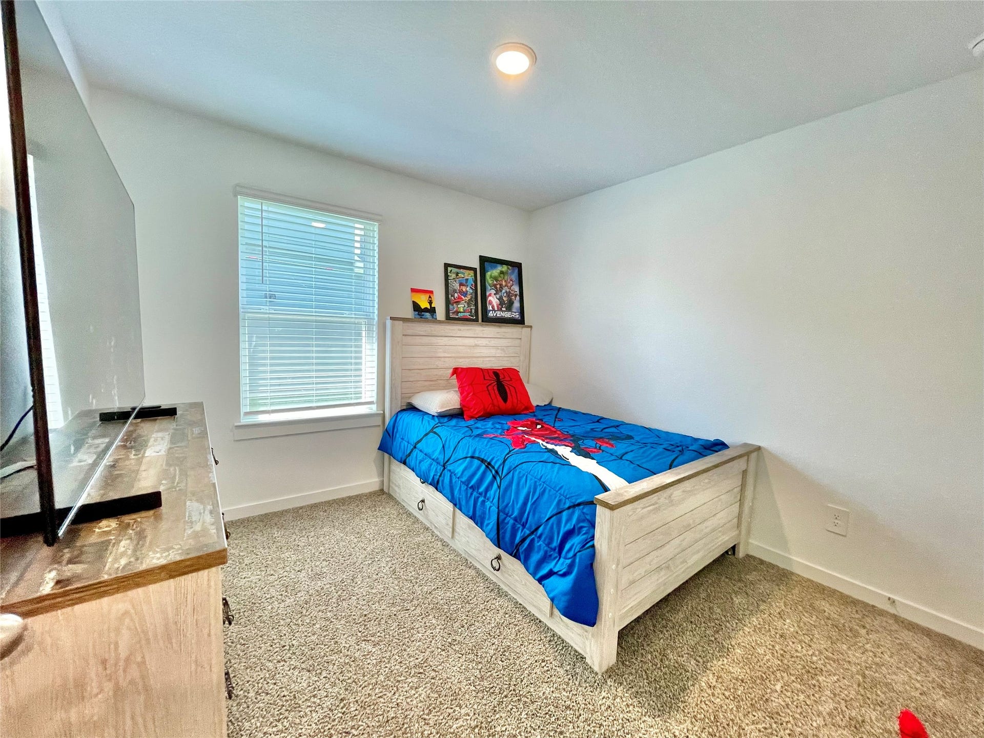 31722 Farlam Farms Trail, Fulshear, TX 77441 comfort meets functionality in this sunlit bedroom, showcasing excellent layout options and great natural light