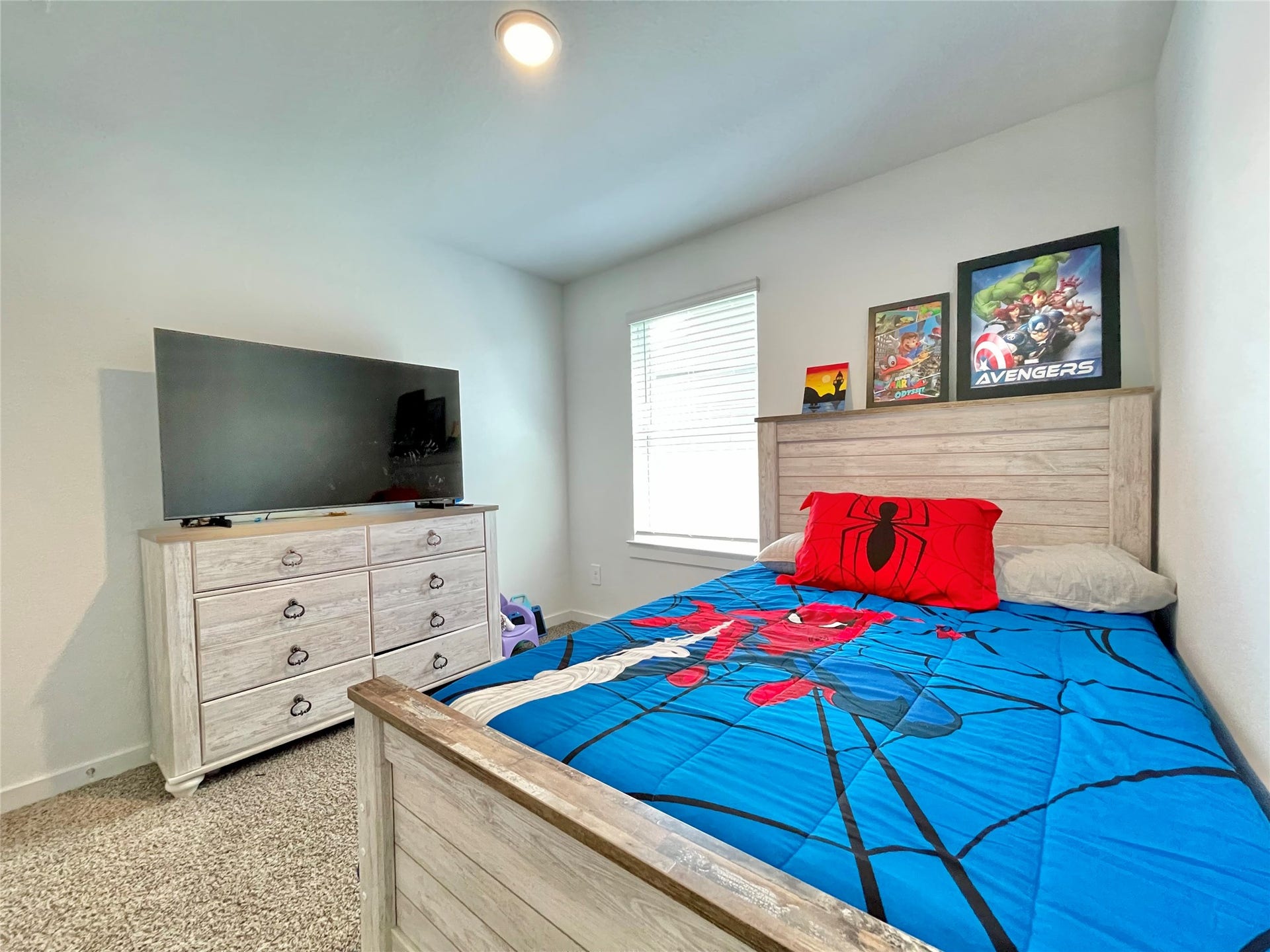31722 Farlam Farms Trail, Fulshear, TX 77441 Another spacious bedroom featuring a fun, vibrant themeideal for children, teens, or adapting into a creative hobby room.