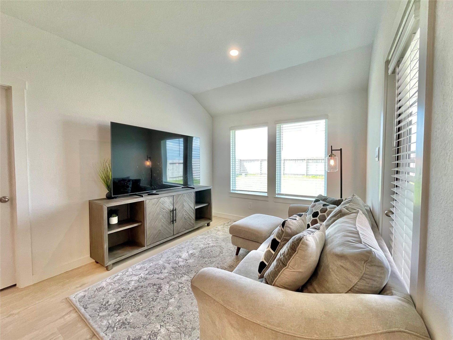 31722 Farlam Farms Trail, Fulshear, TX 77441 Large windows flood this intimate secondary living nook with a warm, relaxing afternoon glow.