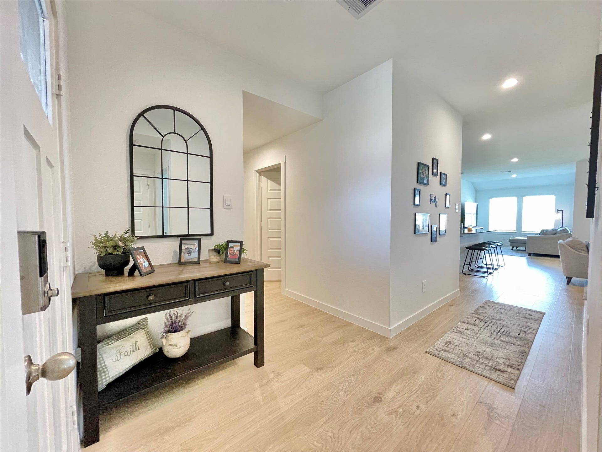 31722 Farlam Farms Trail, Fulshear, TX 77441 Step into a bright, airy foyer that immediately introduces the homes chic, contemporary aesthetic and open-concept flow.