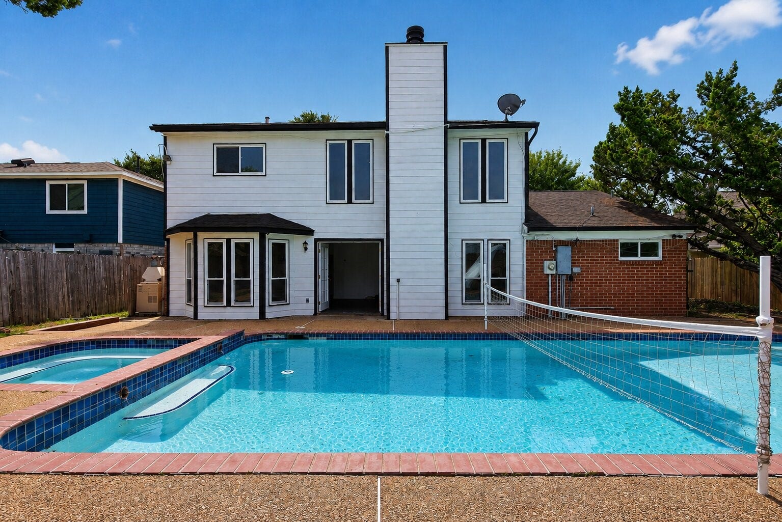 1123 Mayweather Lane, Richmond, TX 77406 The ultimate staycation setup, an expansive pool, spa, and slide turn this backyard into a destination all its own.