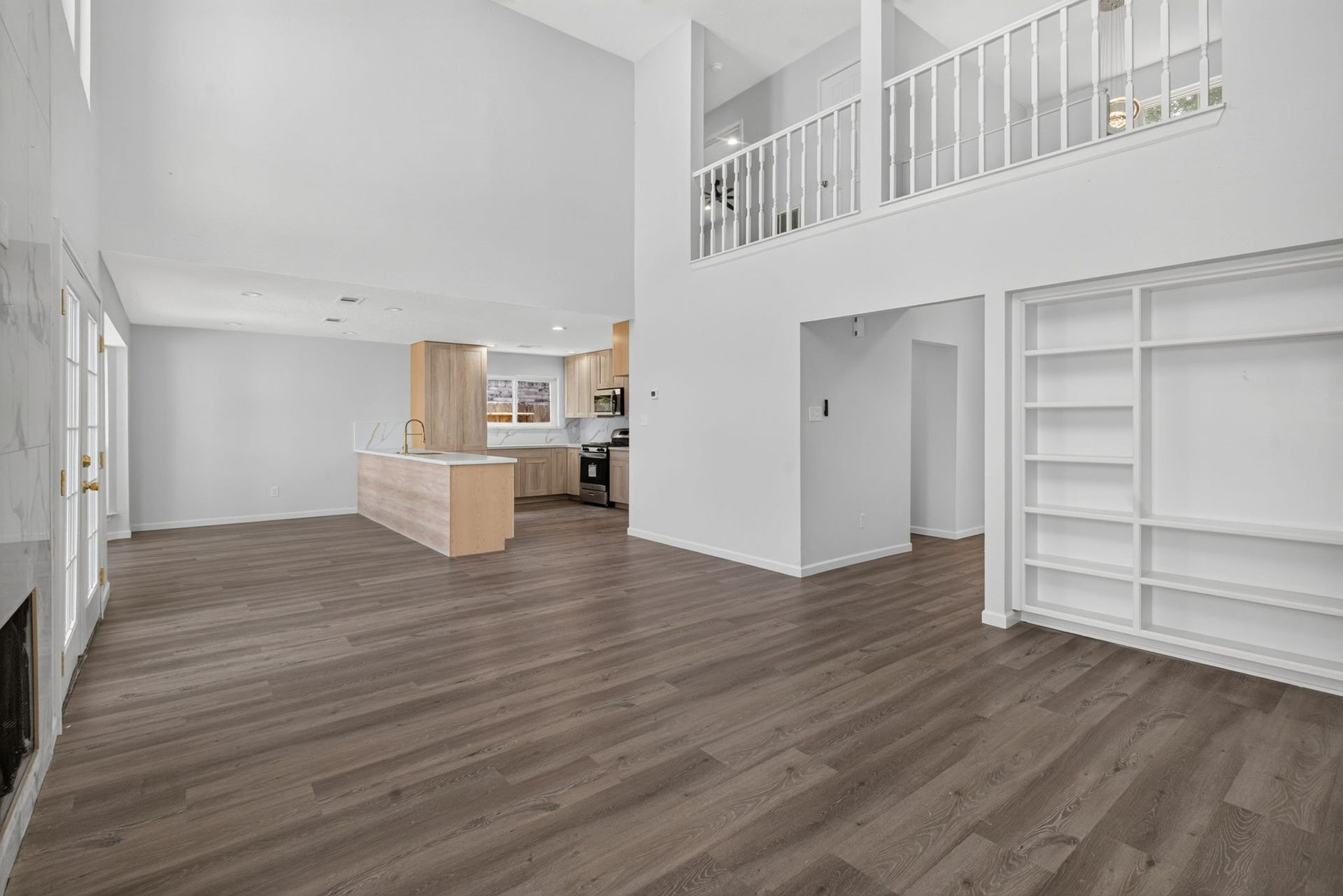 1123 Mayweather Lane, Richmond, TX 77406 Open, spacious, and full of possibilities, this layout keeps the kitchen connected to the main living area while built-in shelving adds both character and everyday functionality.