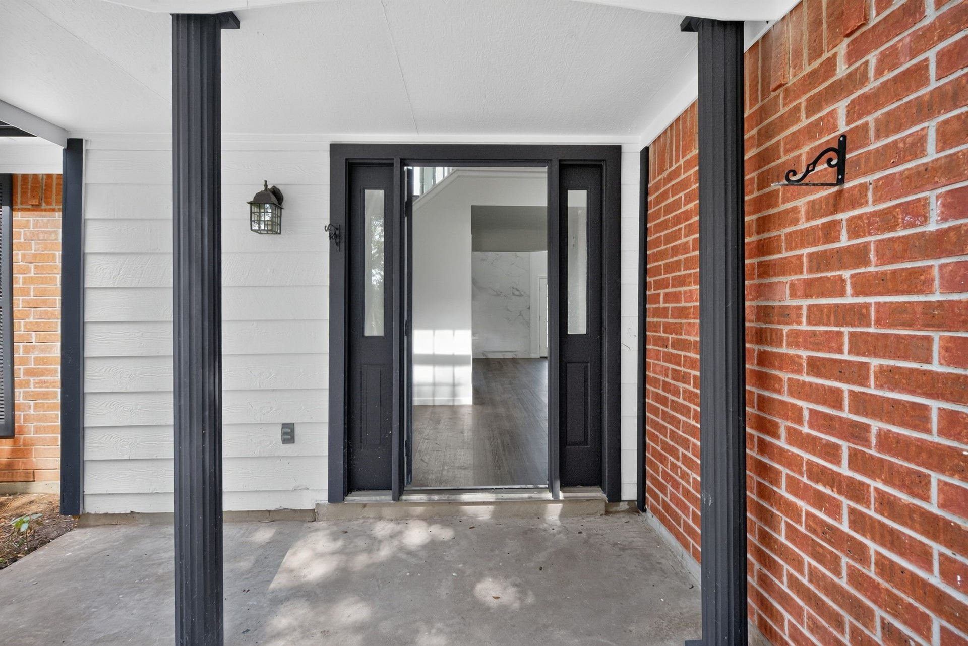 1123 Mayweather Lane, Richmond, TX 77406 A covered entry and bold front door set the tone for the bright, refreshed interiors waiting just beyond.