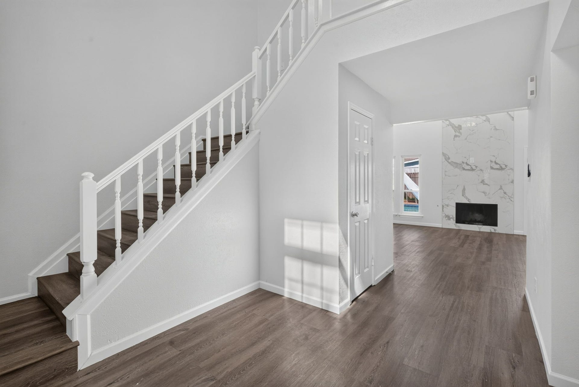 1123 Mayweather Lane, Richmond, TX 77406 From the moment you enter, an open sightline draws you through the home toward the striking fireplace and light-filled living spaces.