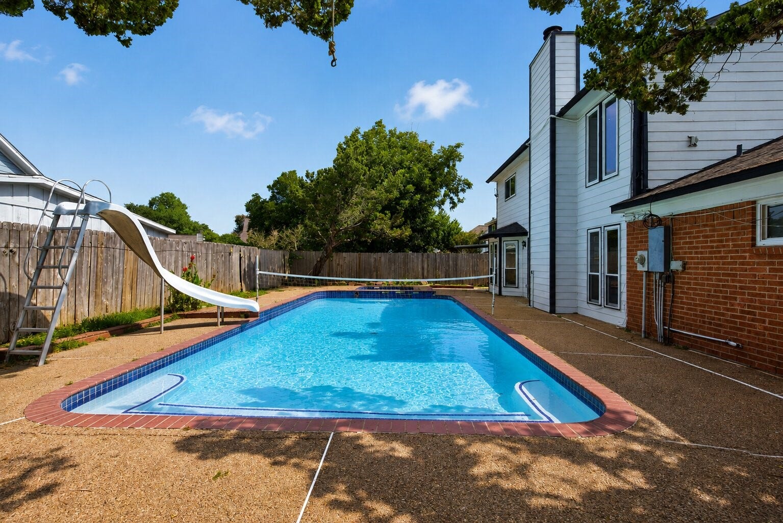 1123 Mayweather Lane, Richmond, TX 77406 A backyard made for making memories, where a sparkling pool transforms home into your favorite warm-weather destination.