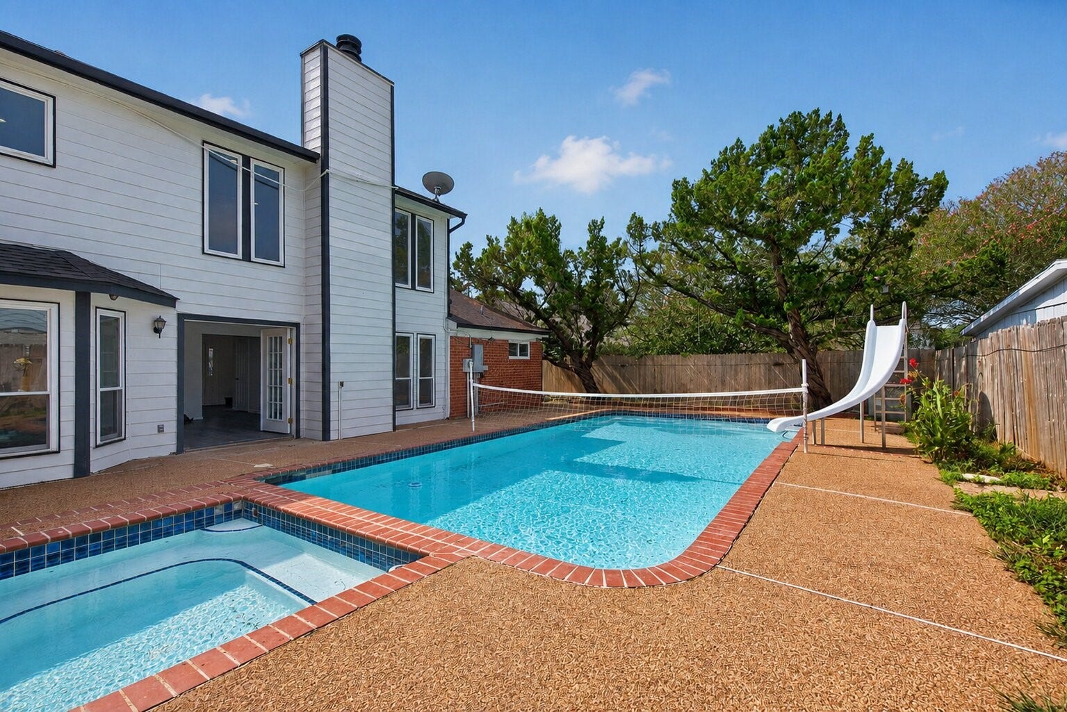 1123 Mayweather Lane, Richmond, TX 77406 Your own backyard escape comes complete with a pool and adjoining spaperfect for energetic afternoons and relaxing evenings alike.