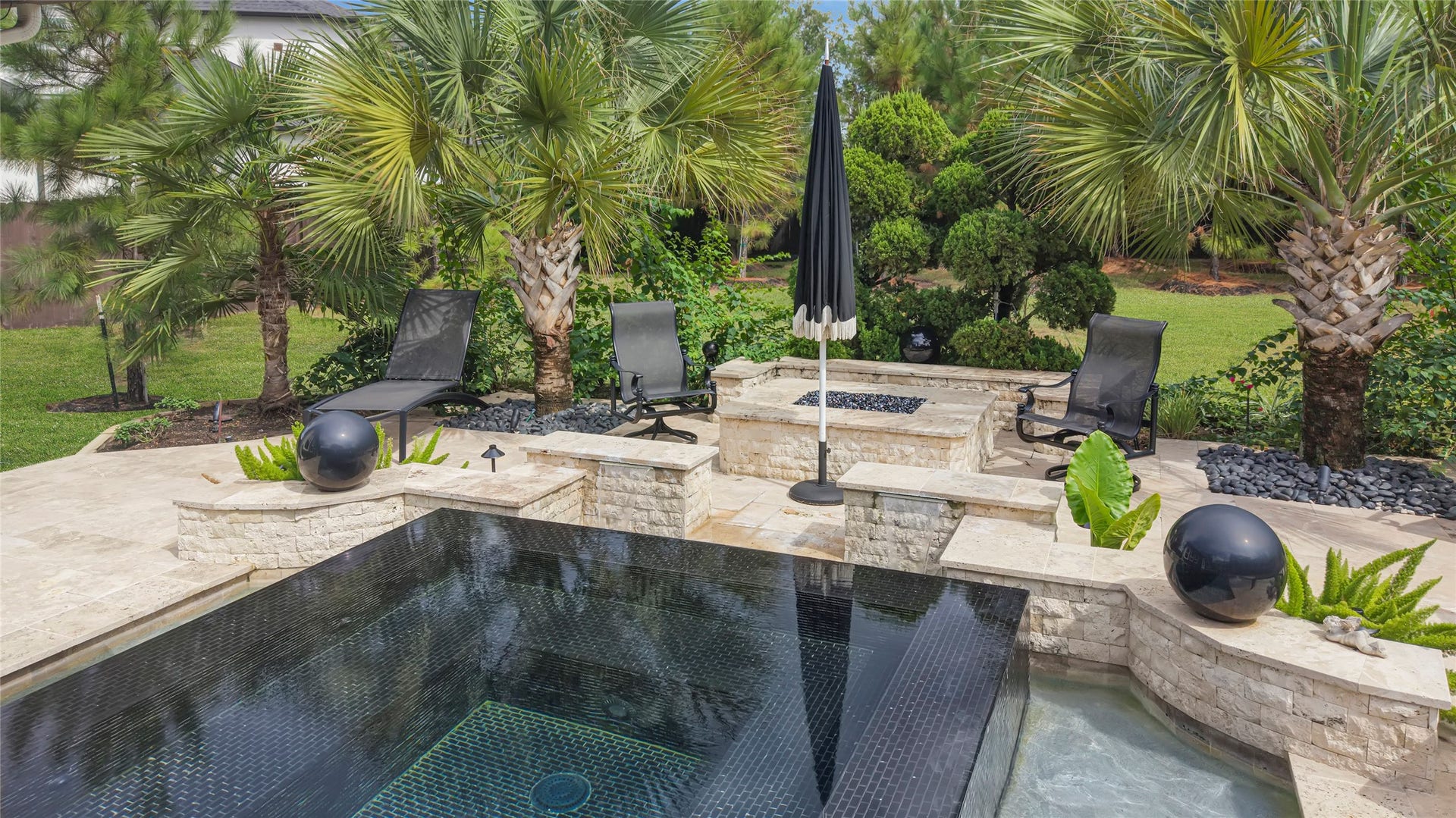 23610 Thortons Park Lane, Spring, TX 77389 Beautiful outdoor firepit area, perfect for relaxing evenings and entertaining guests.