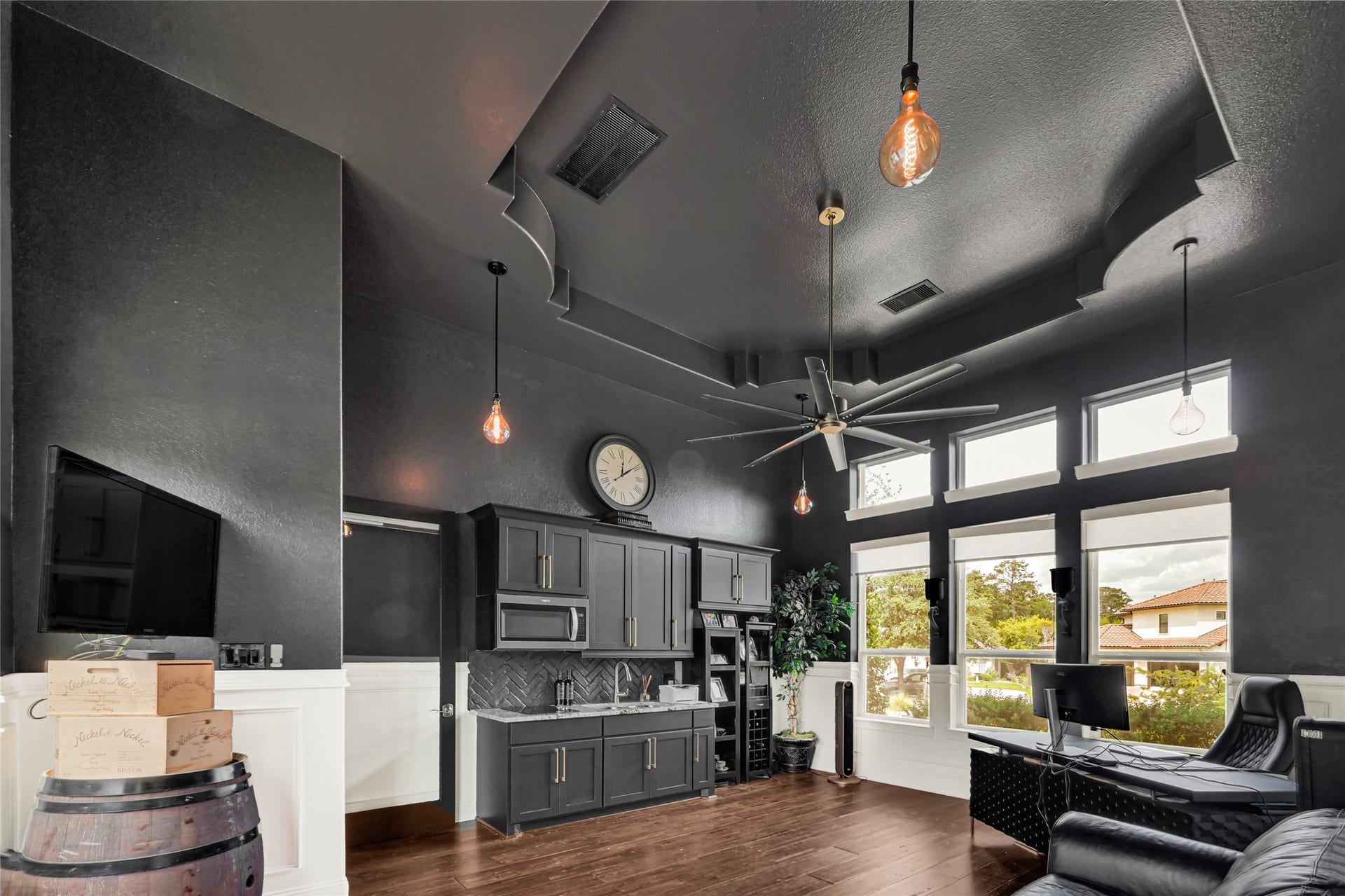 23610 Thortons Park Lane, Spring, TX 77389 Trayed ceilings, abundant natural light, and dramatic paint accented with wainscoting.