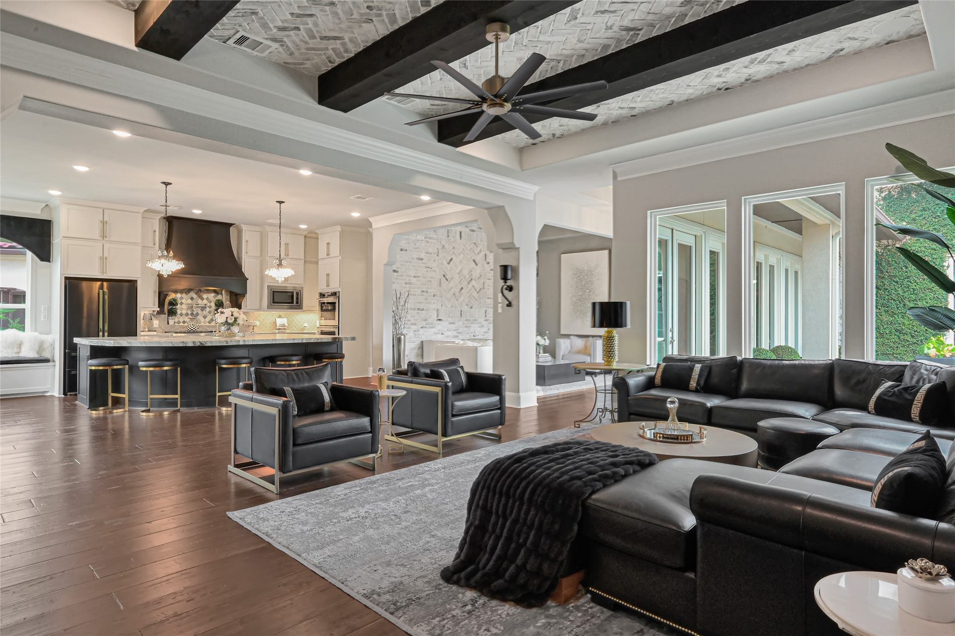 23610 Thortons Park Lane, Spring, TX 77389 Spacious living area featuring a custom brick ceiling, designer beams, and stunning views of the pool.