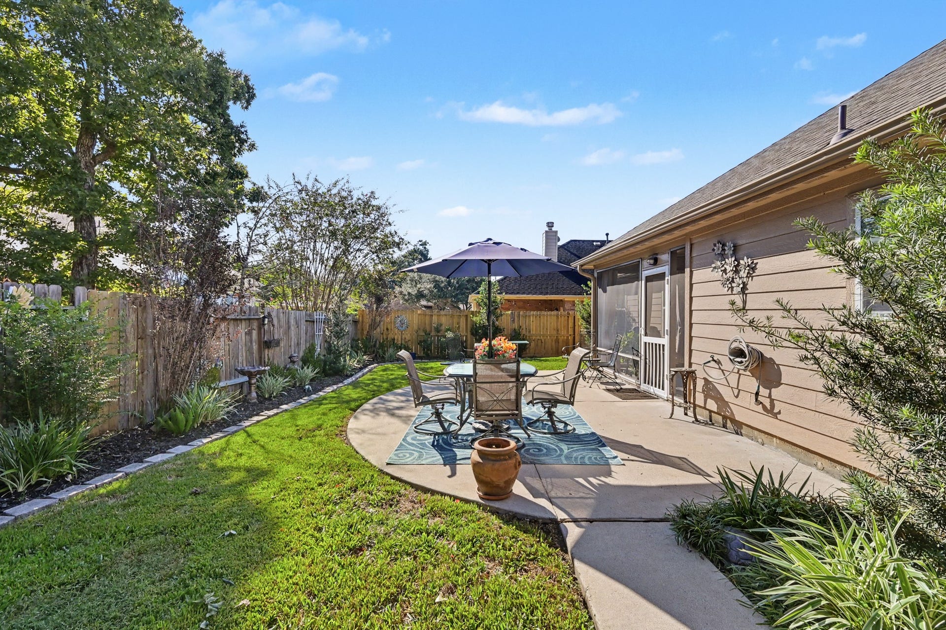 2039 Borthwick Lane, Conroe, TX 77301 Extended patio for outdoor dining & relaxation.