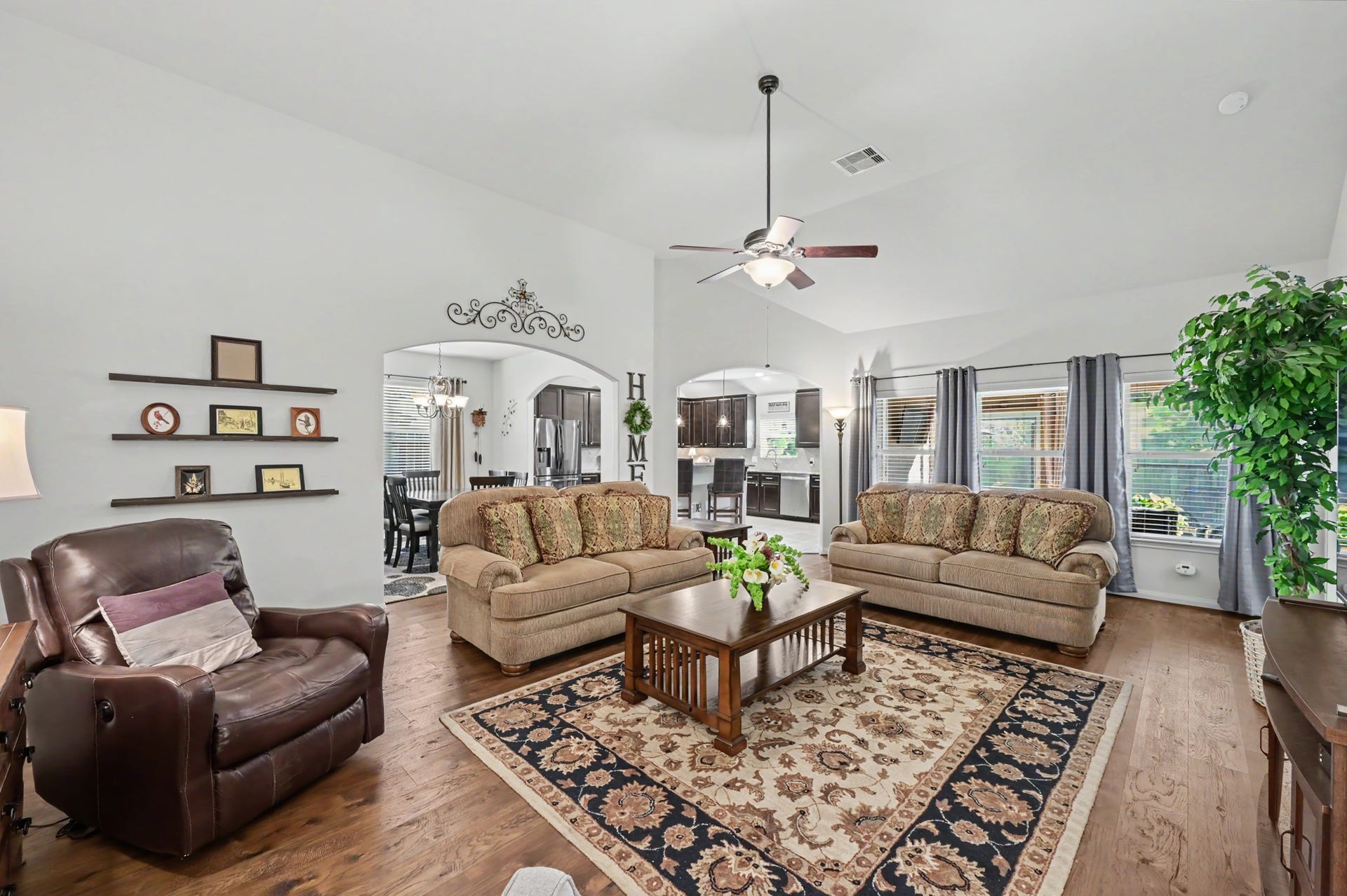 2039 Borthwick Lane, Conroe, TX 77301 Spacious living room with engineered hardwood floors.