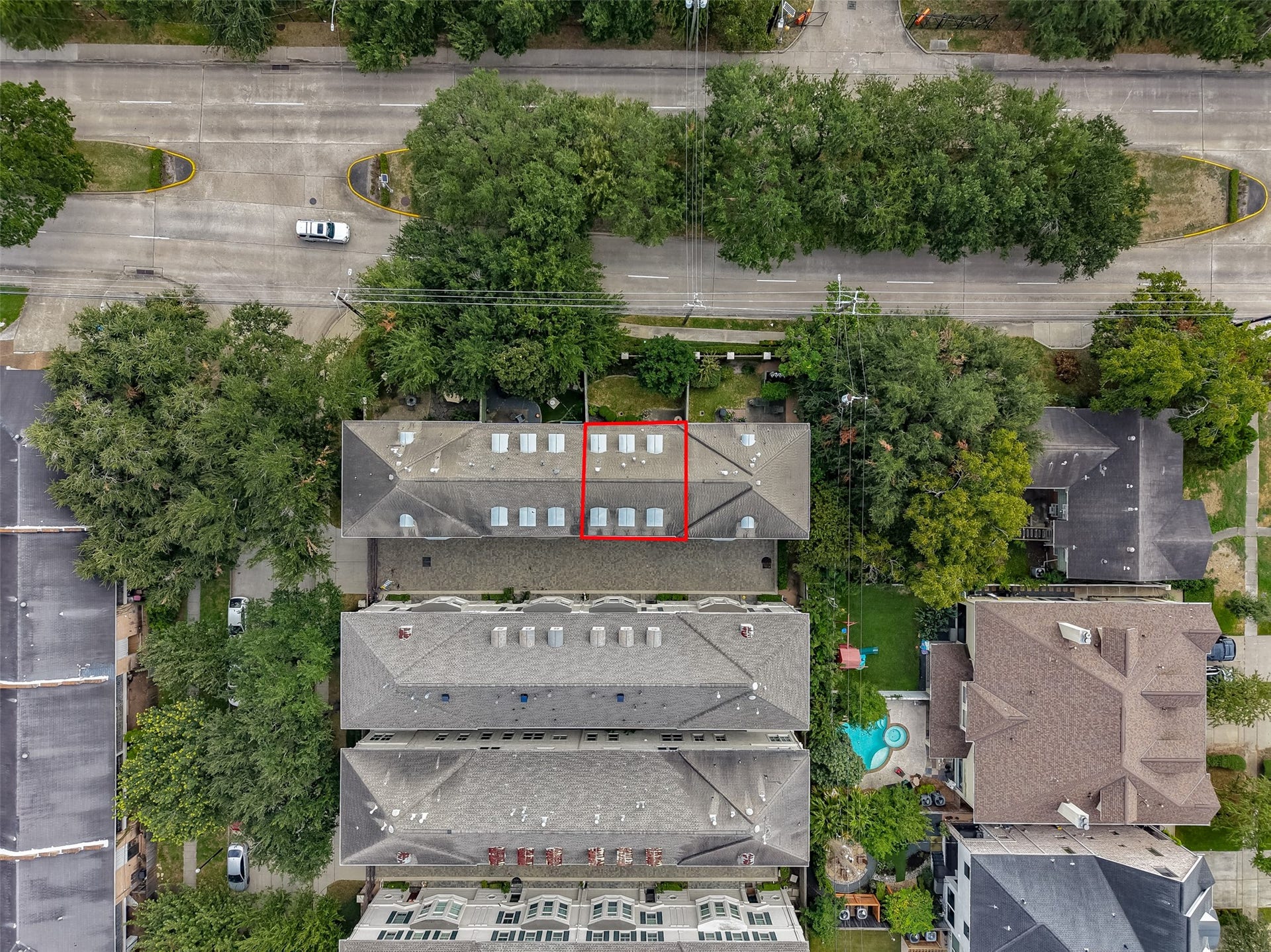 4003 Bellefontaine Street, Houston, TX 77025 Overhead aerial view identifying 4003 Bellefontaine with a red outline, showcasing its position within the gated townhome community, private garden space, and surrounding mature trees.