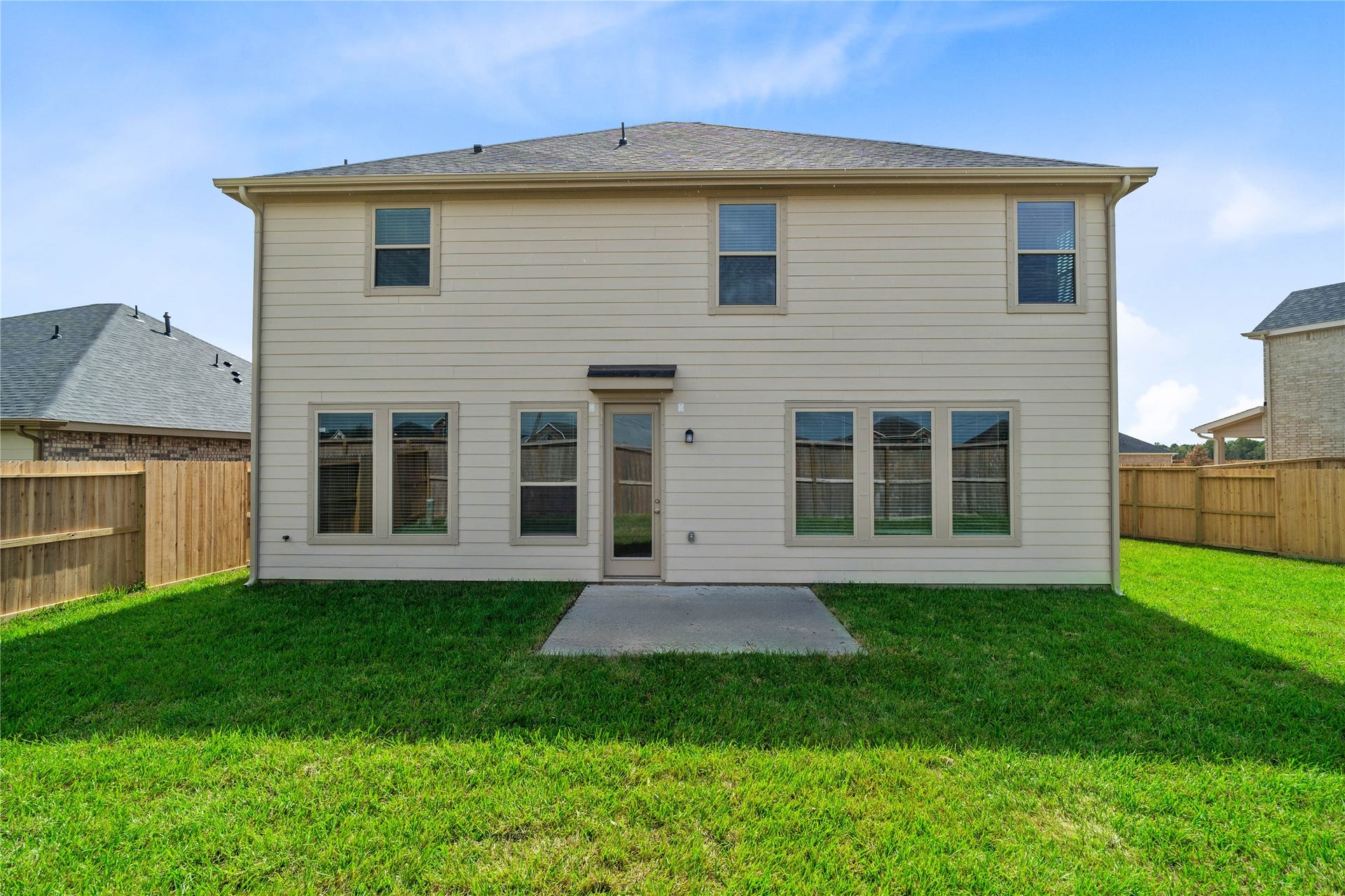Come and see this spacious backyard. There is plenty of room for the kids to play and adults to relax!