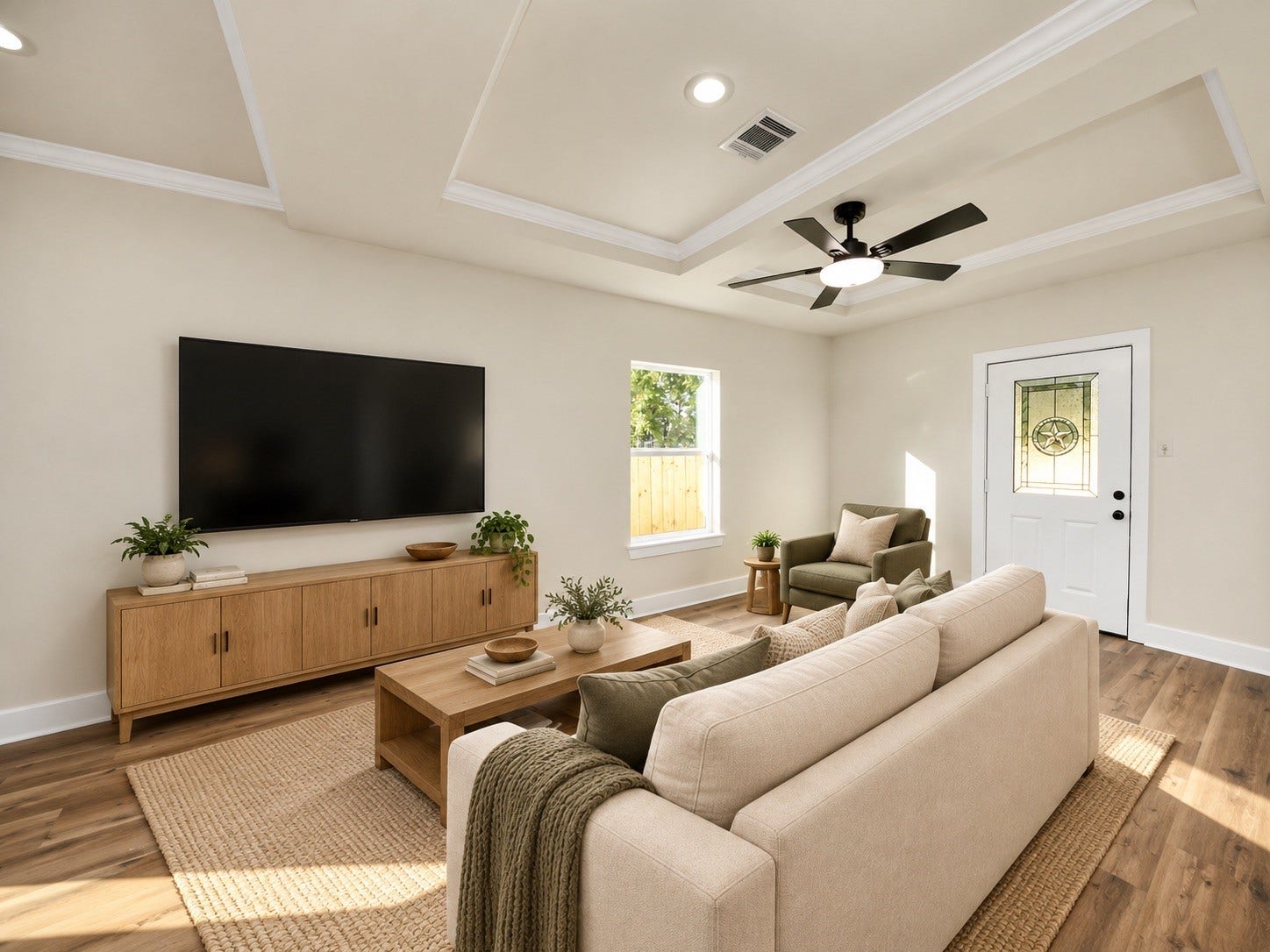 6671 Nielan Street, Houston, TX 77028 Spacious living room featuring tray ceilings, crown molding, ceiling fan, energy-efficient windows & convenient access to the fully fenced backyard | Virtually staged