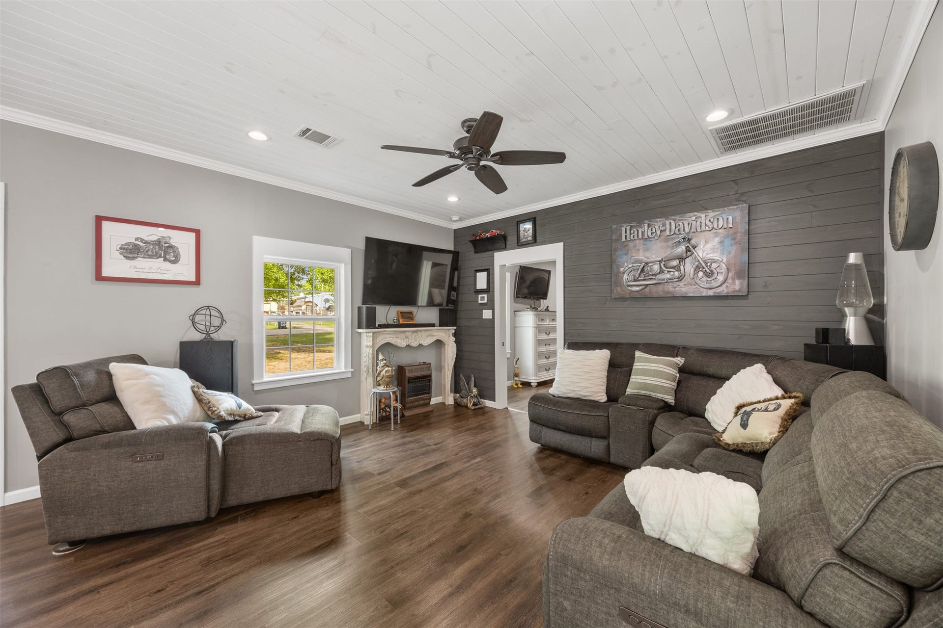 30902 Kate Drive, Magnolia, TX 77355 With beautiful shiplap walls, the family room connects with the open eat in kitchen. Flooring throughout is new luxury vinyl.