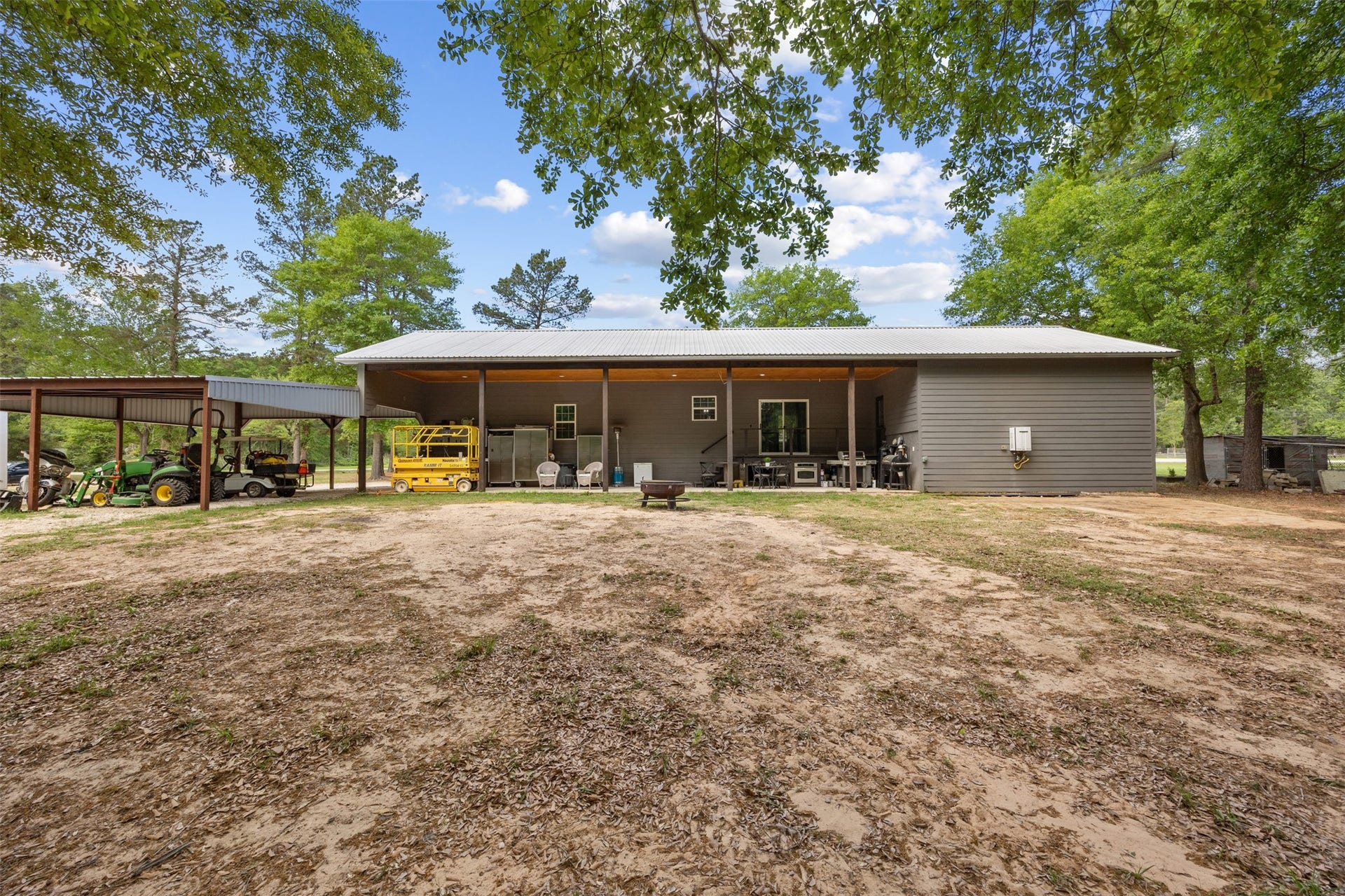 30902 Kate Drive, Magnolia, TX 77355 Looking from the back side of the acreage towards the back porch. Do you like chickens? A coop is ready to be put to use