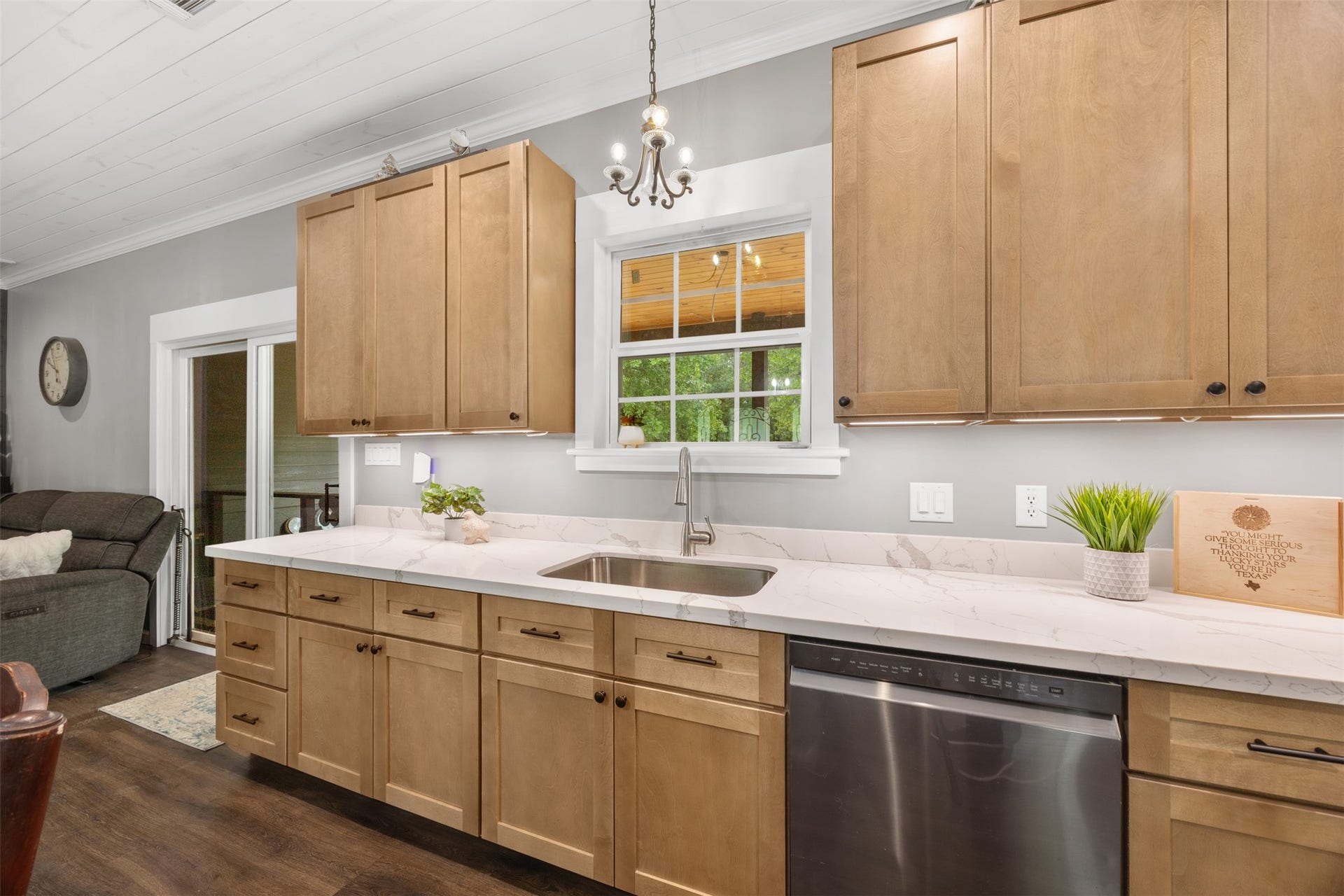 30902 Kate Drive, Magnolia, TX 77355 Kitchen has under counter lighting along with cute hanging light over the sink. Sink window overlooks back porch