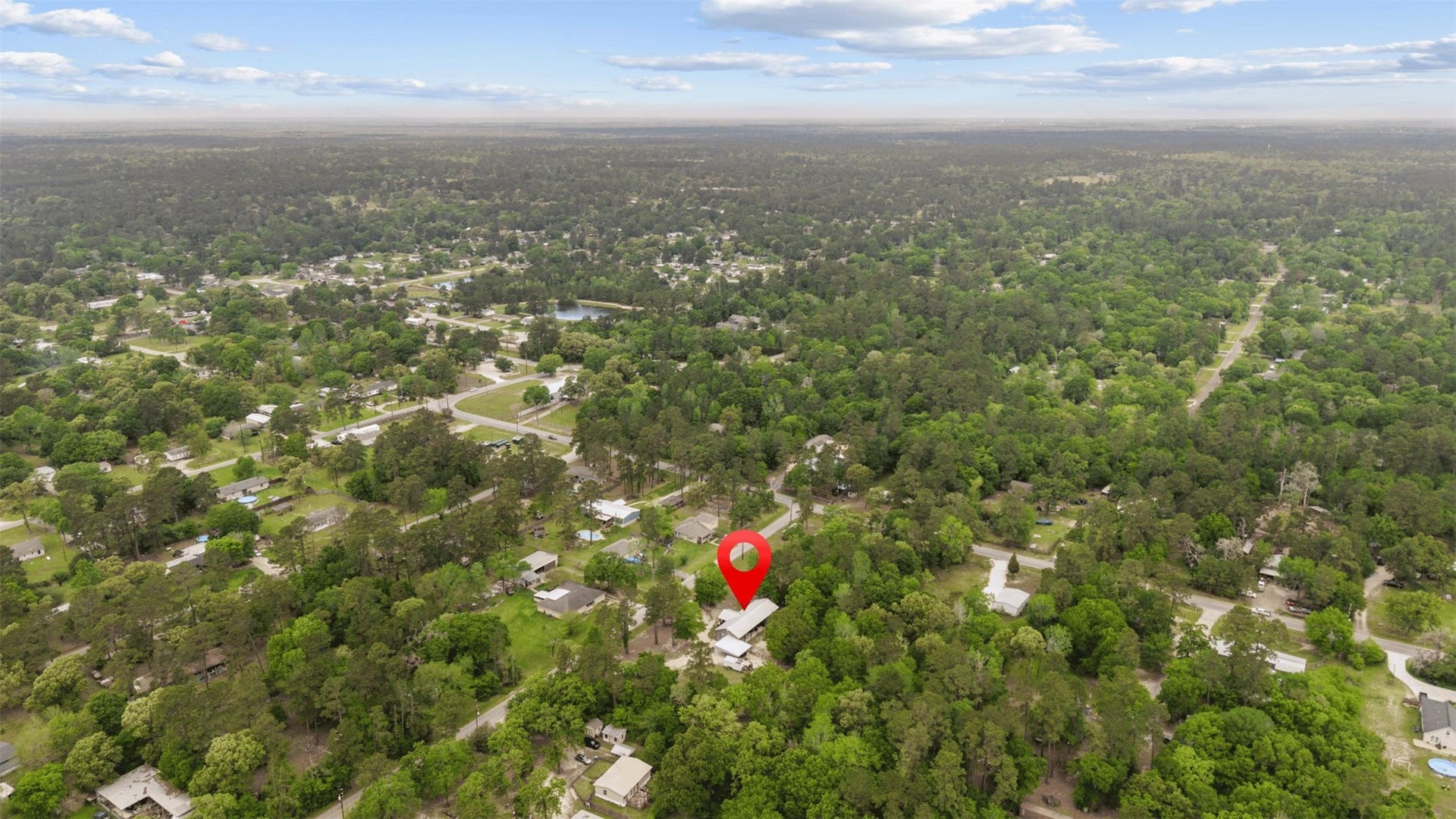 30902 Kate Drive, Magnolia, TX 77355 Aerial view of the property nestled within the trees of Magnolia