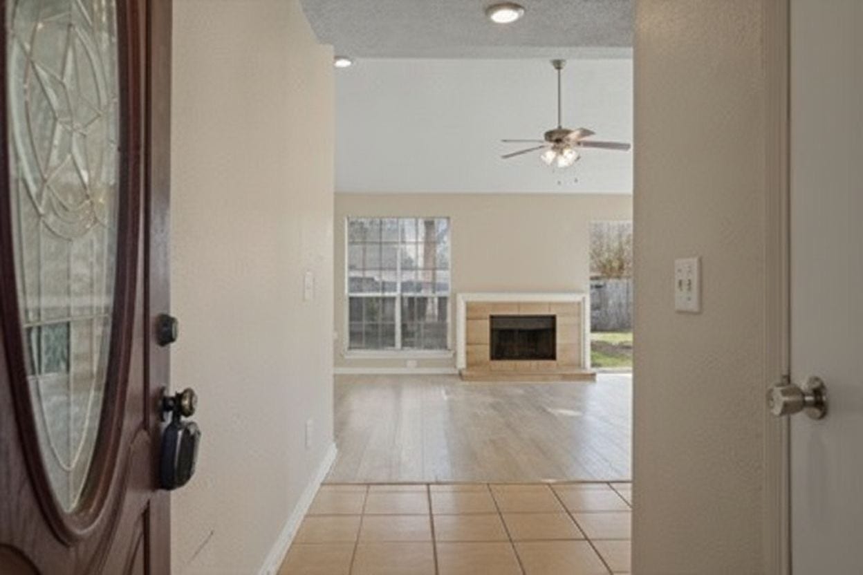 4522 Alamo Avenue, Sugar Land, TX 77479 View from the entryway leading into the living area with a fireplace.
