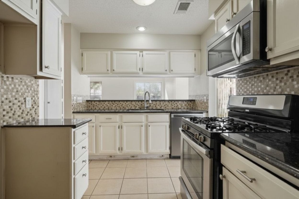 4522 Alamo Avenue, Sugar Land, TX 77479 Kitchen featuring granite countertops, tile backsplash, and stainless steel appliances.