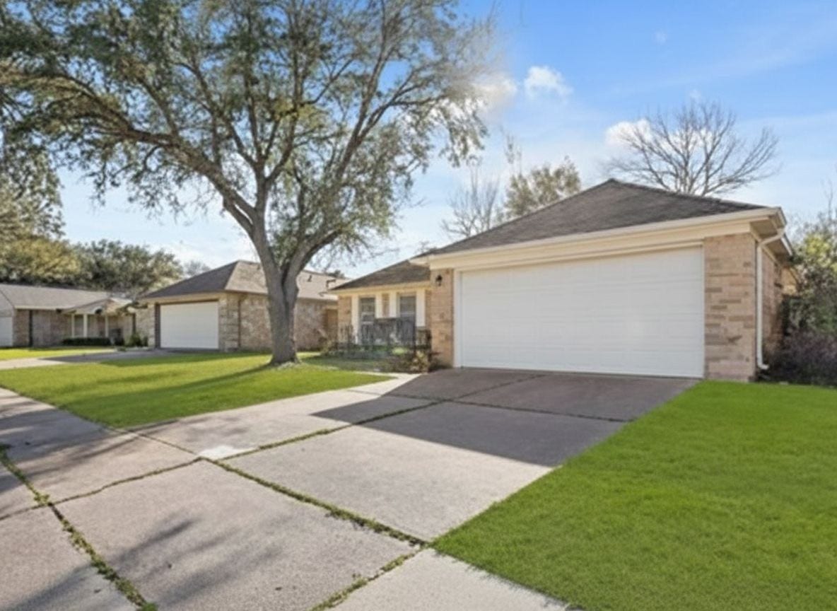 4522 Alamo Avenue, Sugar Land, TX 77479 Front exterior view of the home with an attached two-car garage and mature landscaping.