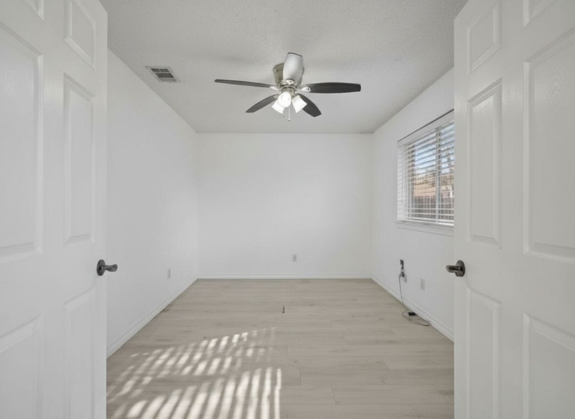 4522 Alamo Avenue, Sugar Land, TX 77479 Spacious bedroom with ceiling fan, natural light, and dual closets.