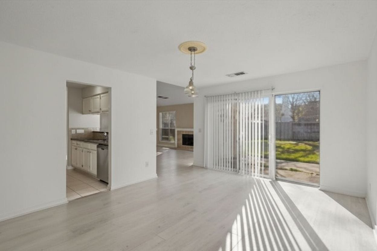 4522 Alamo Avenue, Sugar Land, TX 77479 Dining area with backyard access and views into the kitchen and living area.