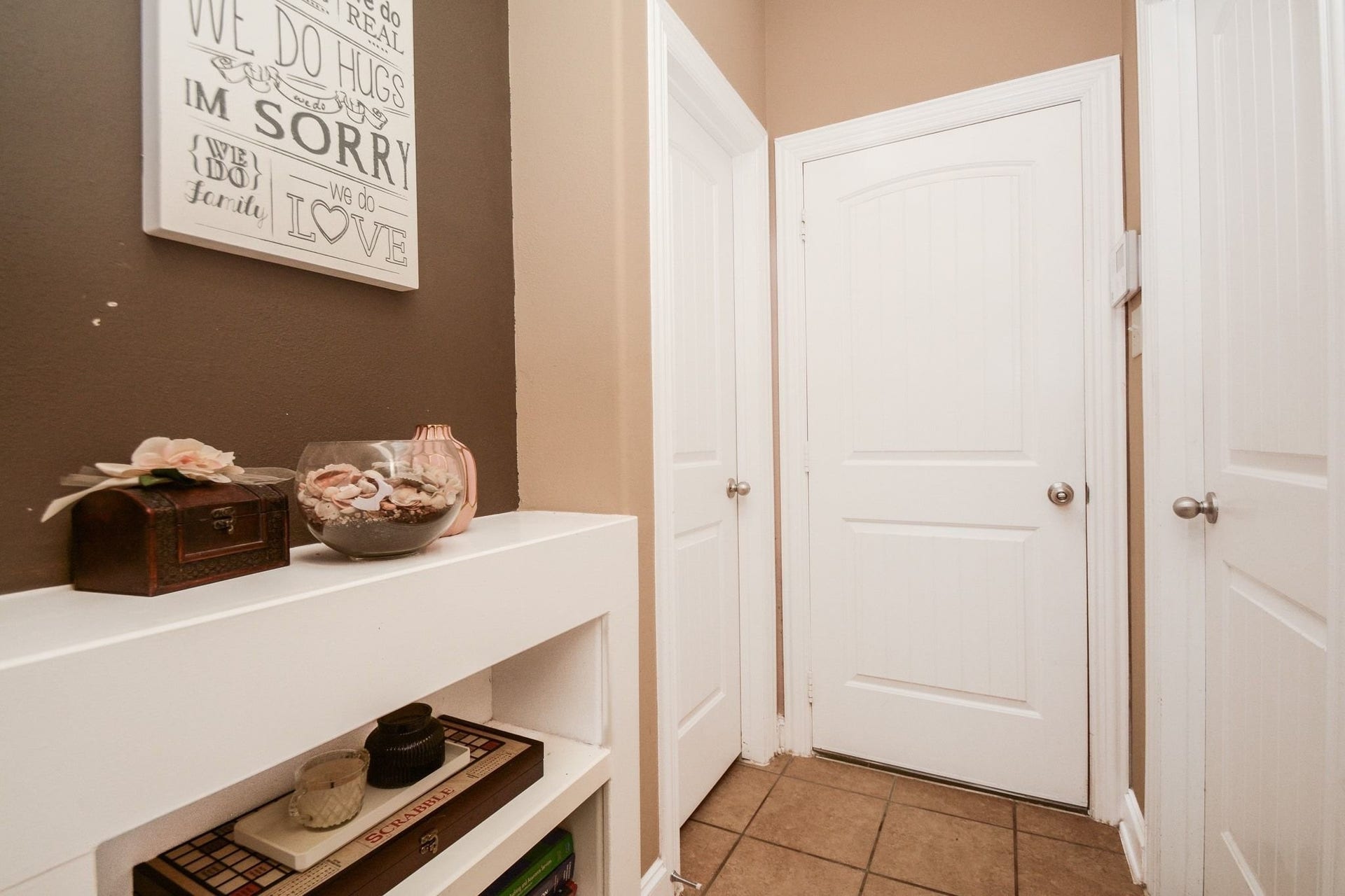 Little storage area from the 2 car garage, half bath and laundry room (with storage area, enough room for another fridge.)
