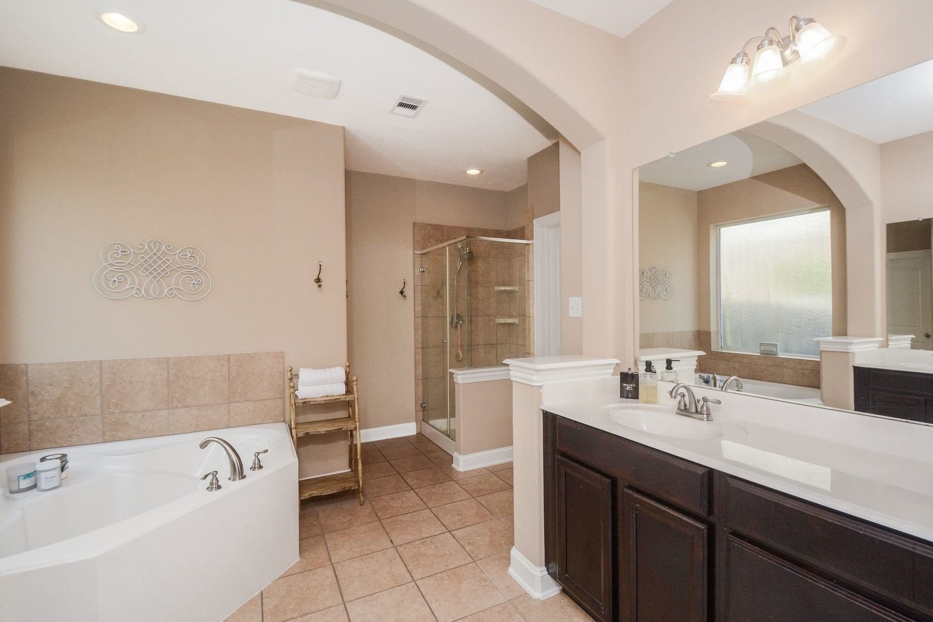 large garden tub, with separate shower, and large walk in closet.