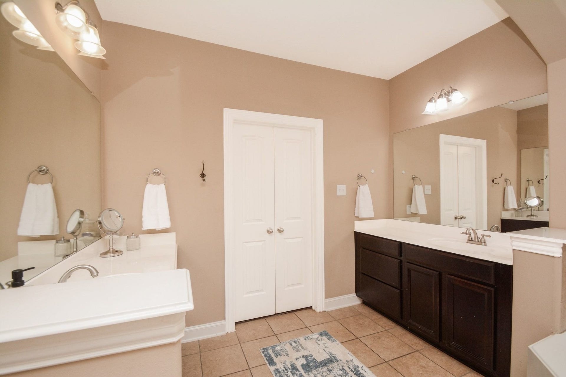 Double vanities, brush nickel fixtures.